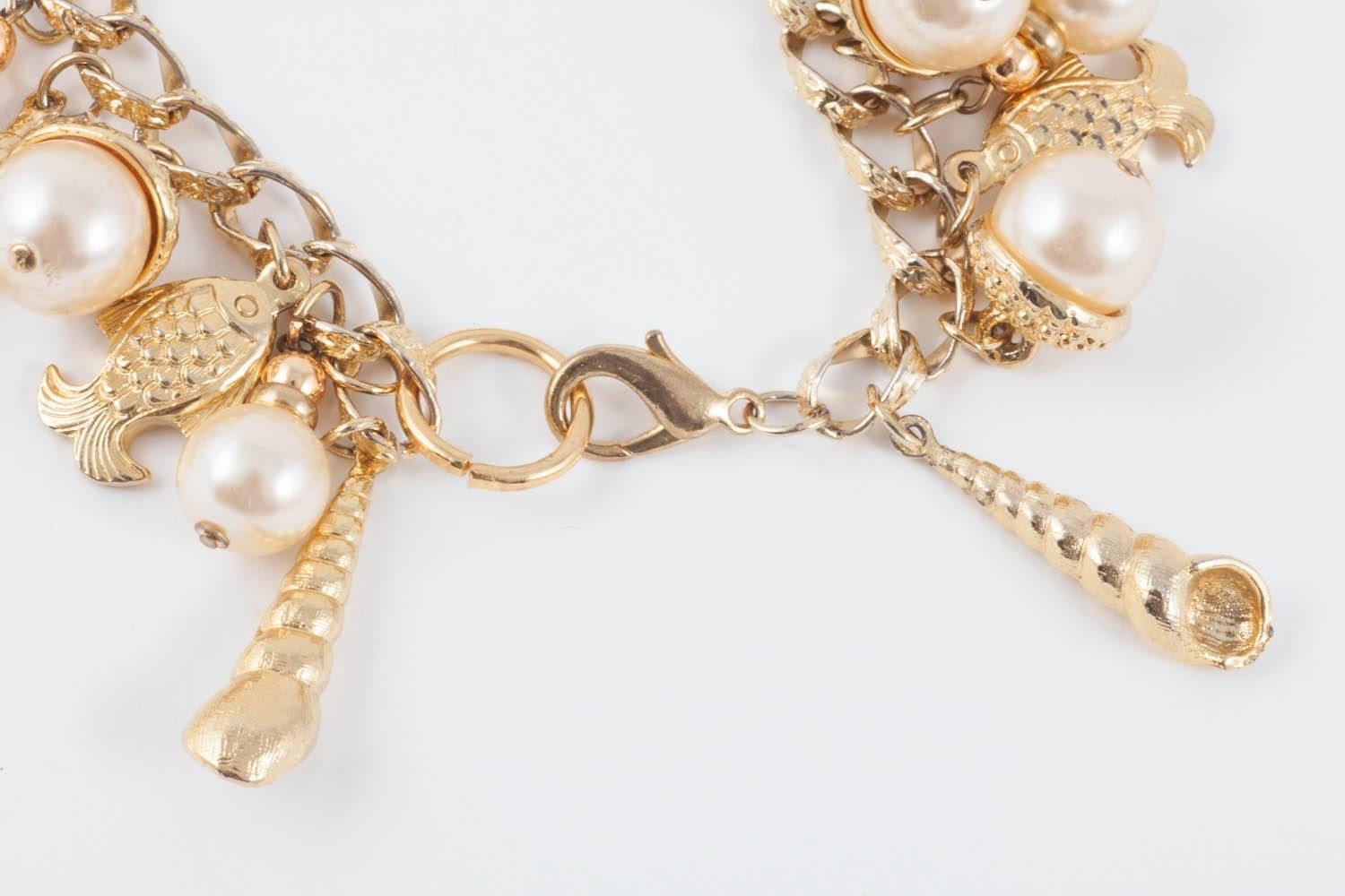 Large gilt metal and paste pearl 'seashell' charm bracelet, USA, 1960s 1