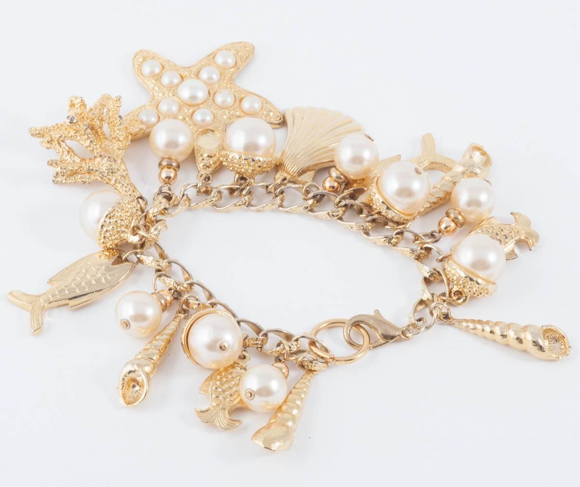 Large gilt metal and paste pearl 'seashell' charm bracelet, USA, 1960s 2