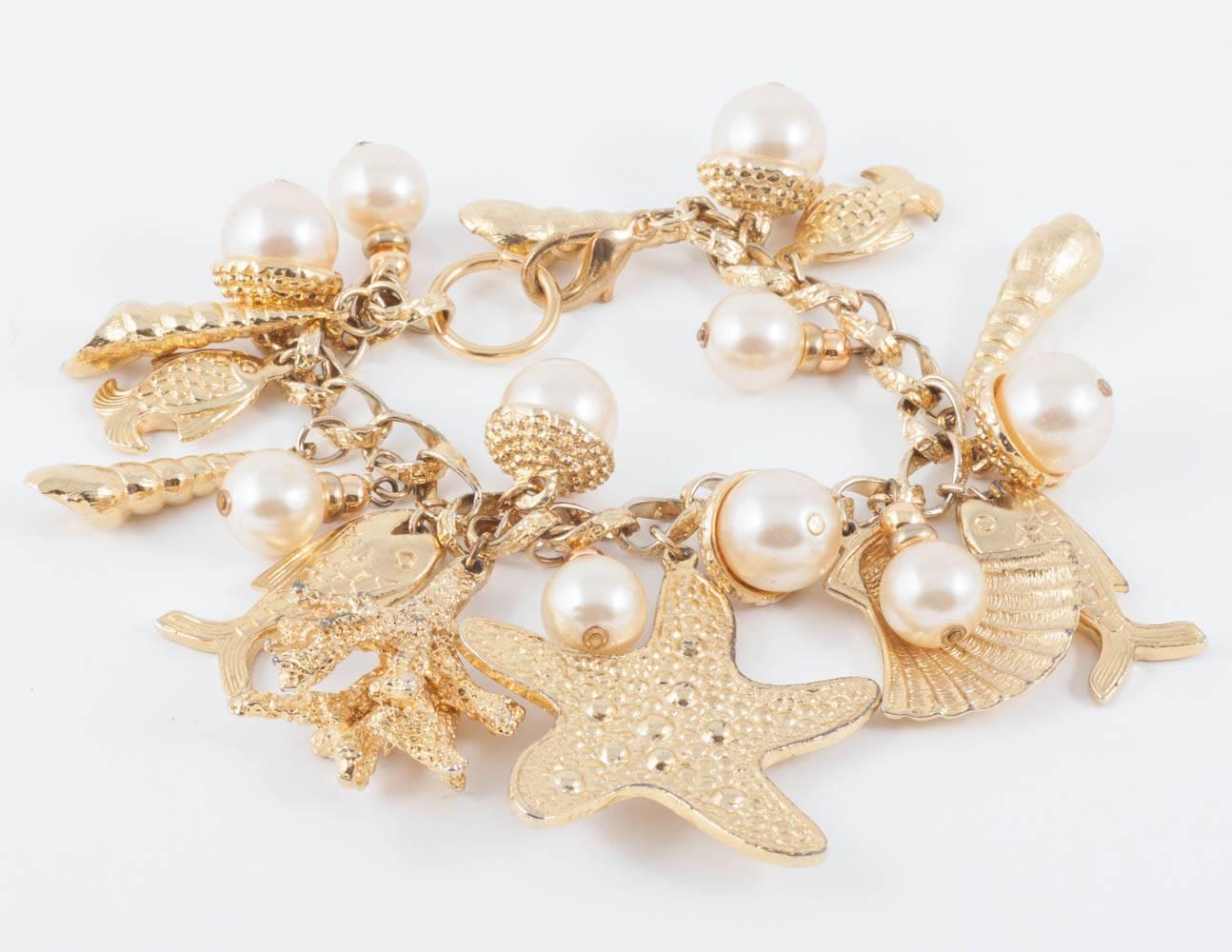 Large gilt metal and paste pearl 'seashell' charm bracelet, USA, 1960s 4