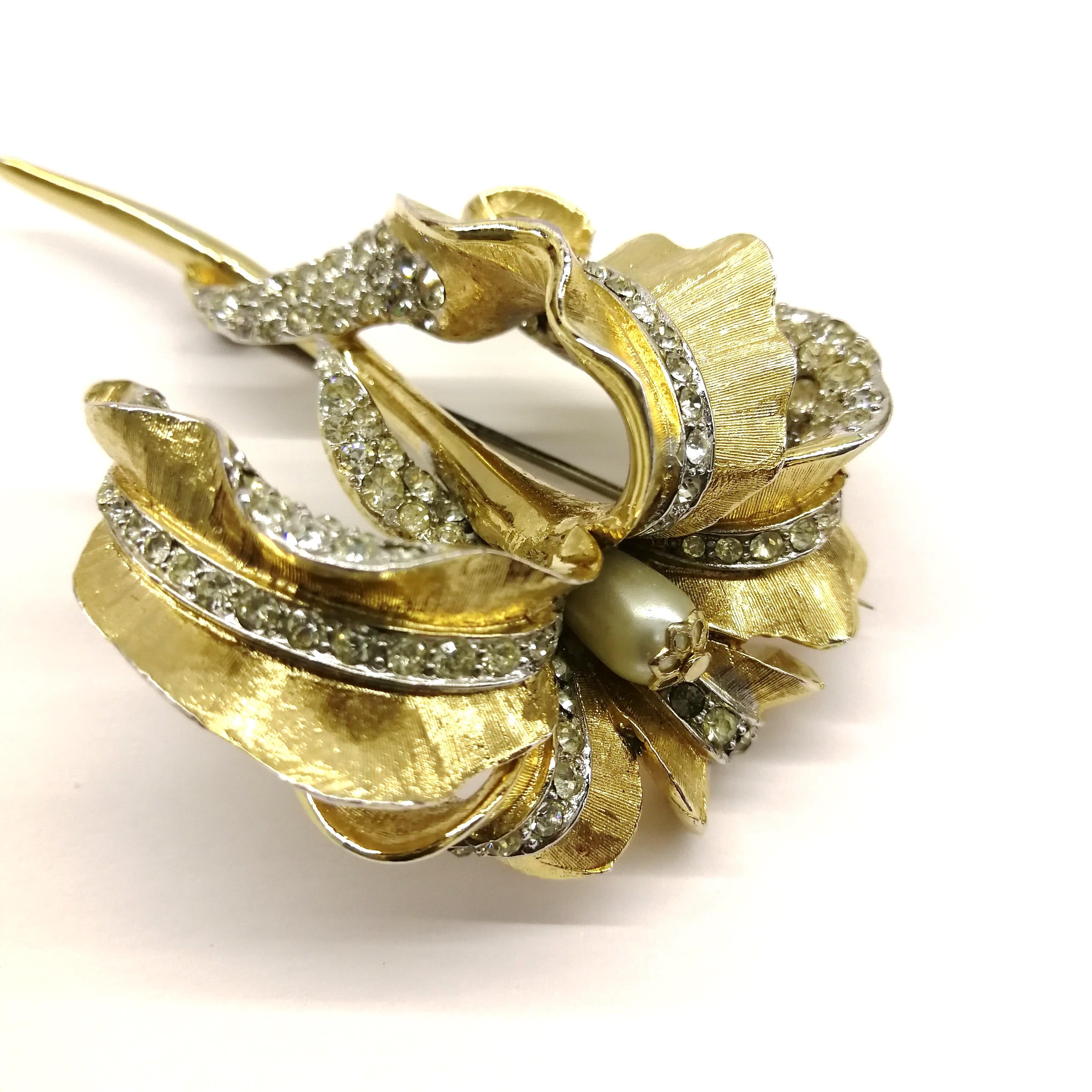 Large gilt metal, clear paste 'orchid' brooch, Marcel Boucher, 1960s, USA. 1
