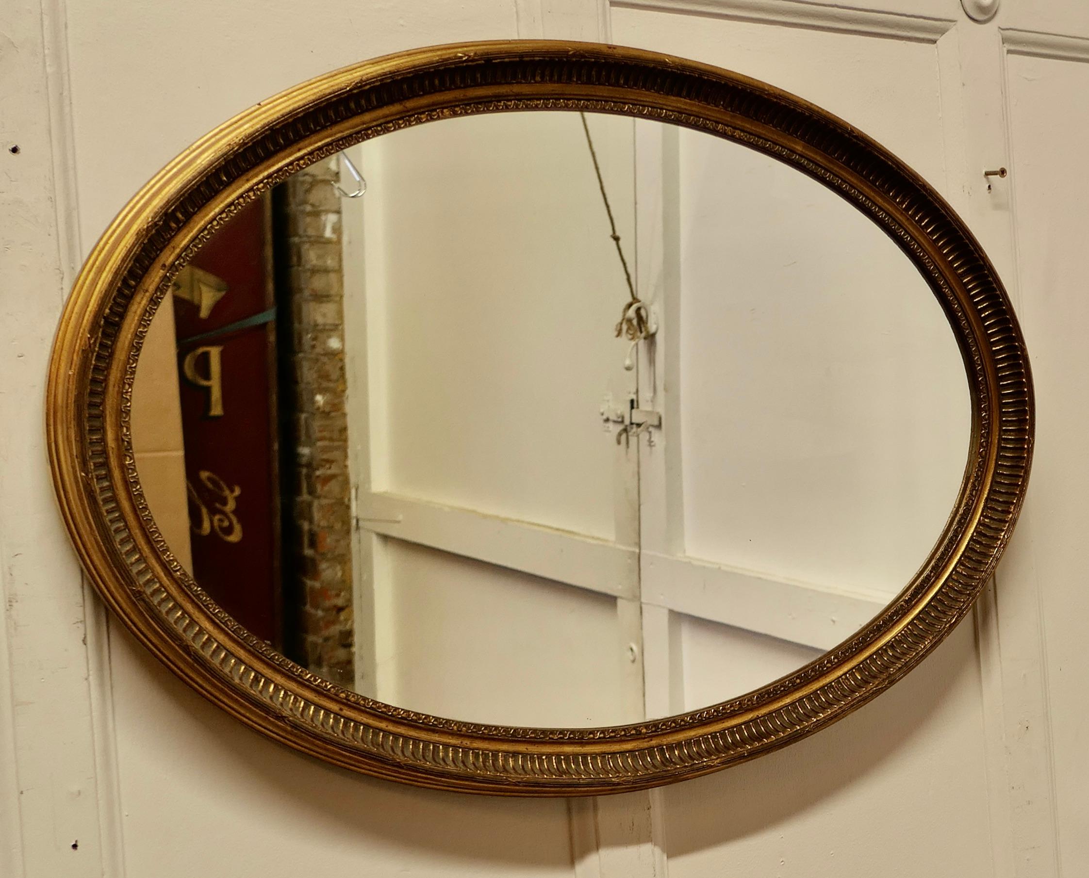Victorian Large Gilt Oval Mirror    For Sale