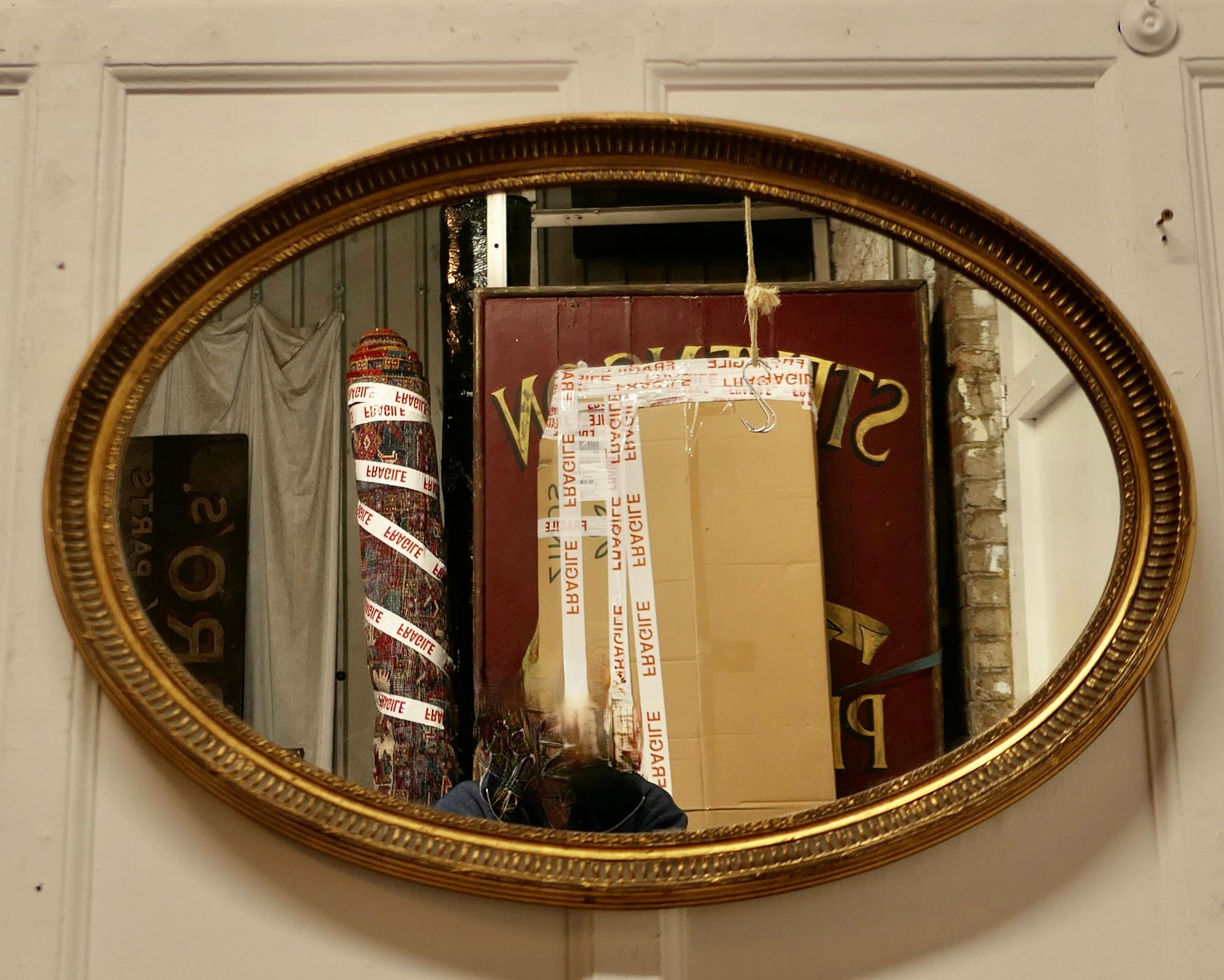 19th Century Large Gilt Oval Mirror    For Sale