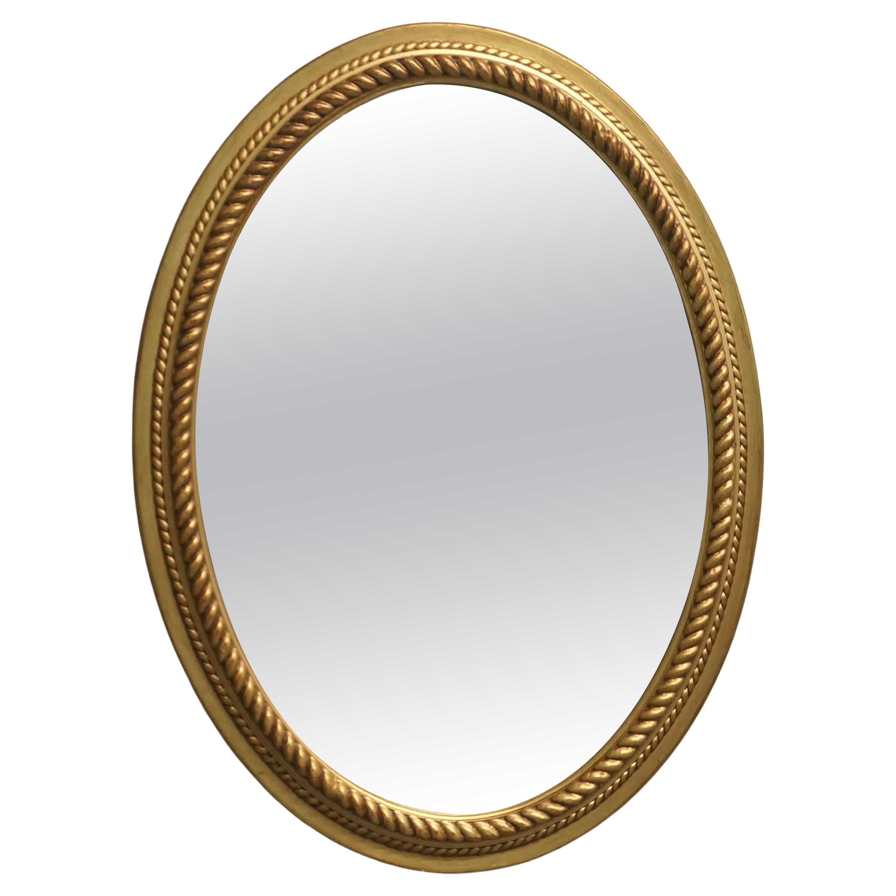 Grand miroir ovale doré avec bordure en corde