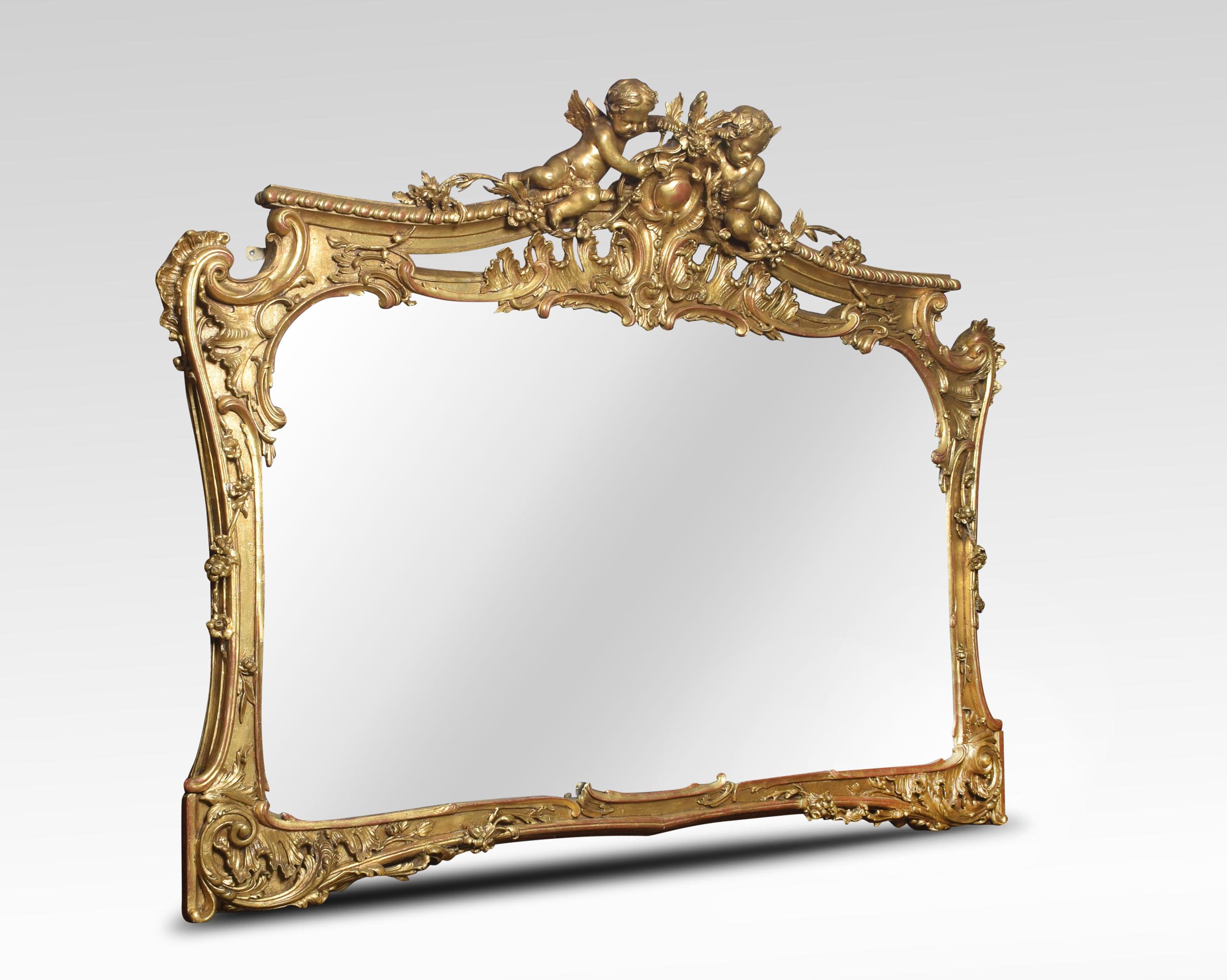 19th century gilt overmantel mirror. The shaped rectangular mirror plate surmounted with winged cherubs over a rocaille carved and pierced frieze, floral trails and rocaille work extending throughout the frame.
Dimensions:
Height 59 inches
Width
