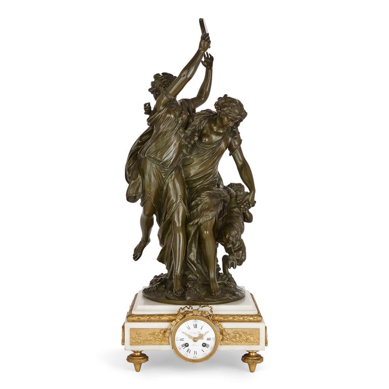 Large gilt, patinated bronze and marble clock set by Raingo Frères
French, Late 19th Century
Clock: height 73cm, width 29cm, depth 28cm
Candelabra: height 66cm, width 30cm, depth 26cm

By the French firm Raingo Frères (French, founded in 1823),