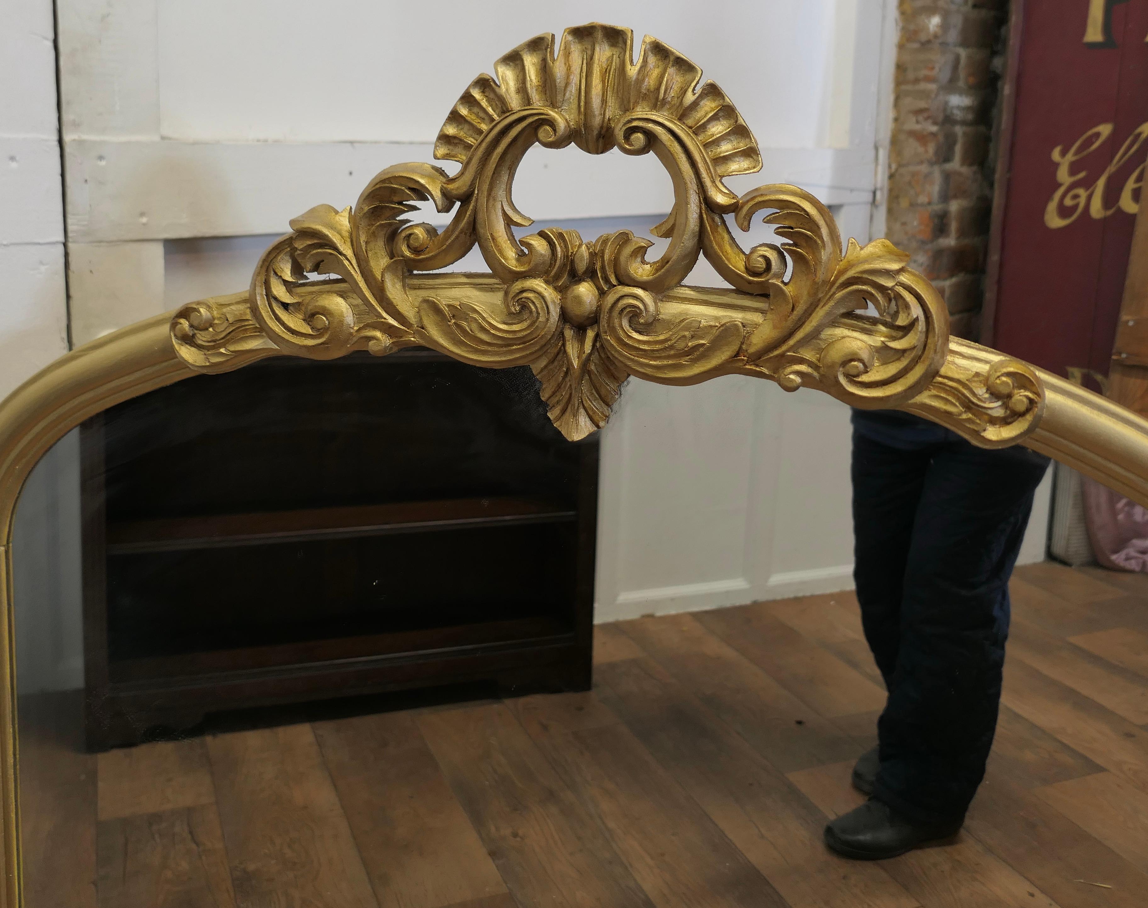 20th Century Large Gilt Rococo Style Arched Over Mantle Mirror     
