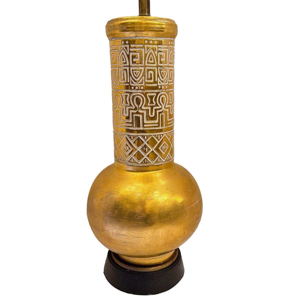 A circa 1960 French gilt porcelain table lamp.

Measurements:
Height of body: 21