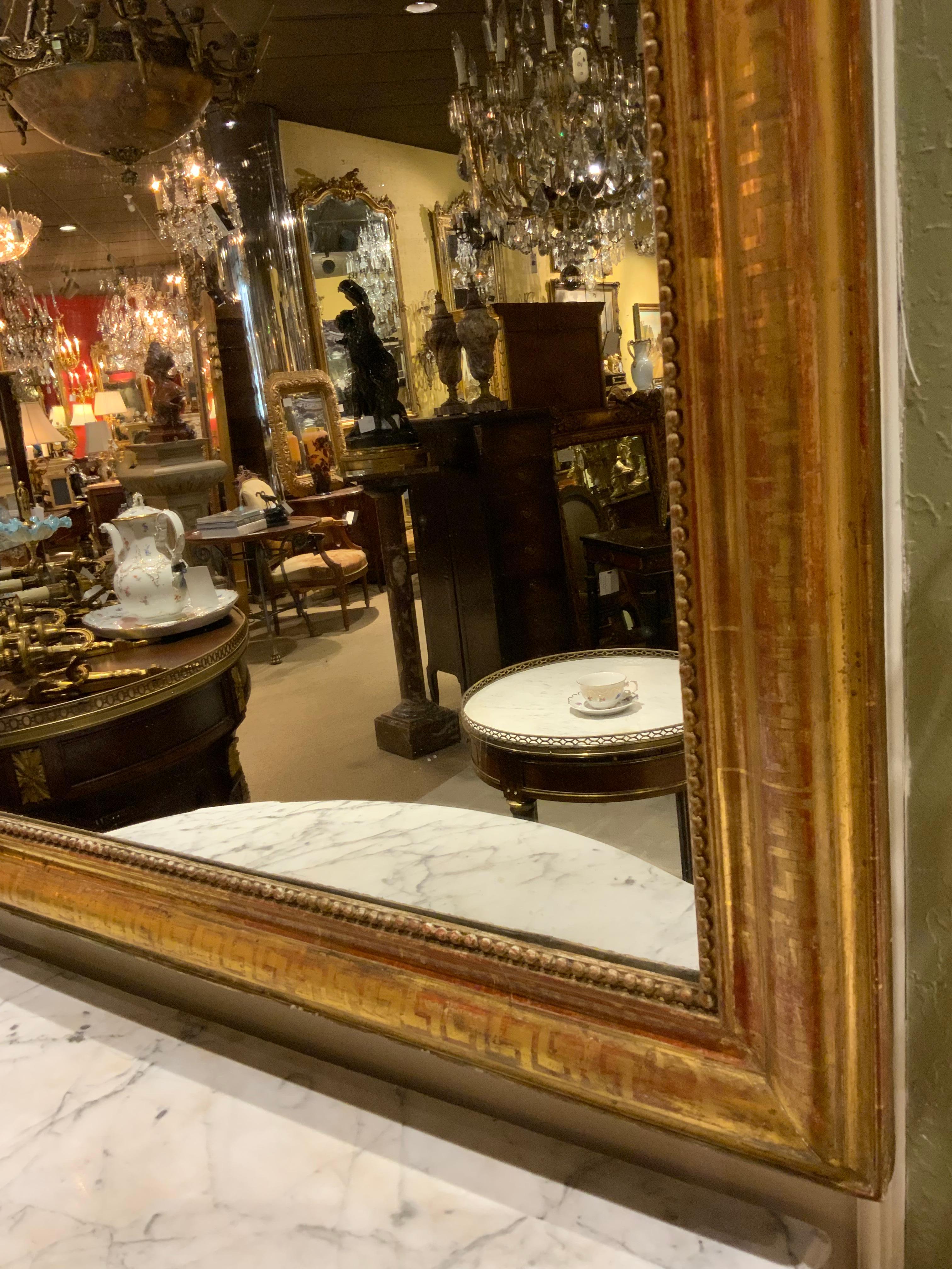 19th Century Large Giltwood Charles X-Style French Mirror with Beading and Original Plate For Sale