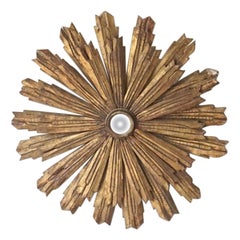 Grand miroir étoilé italien en bois doré