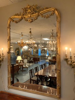Large giltwood louis XV-Style mirror with floral carved embellishments