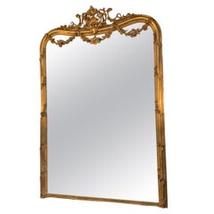 Large giltwood louis XV-Style mirror with floral carved embellishments