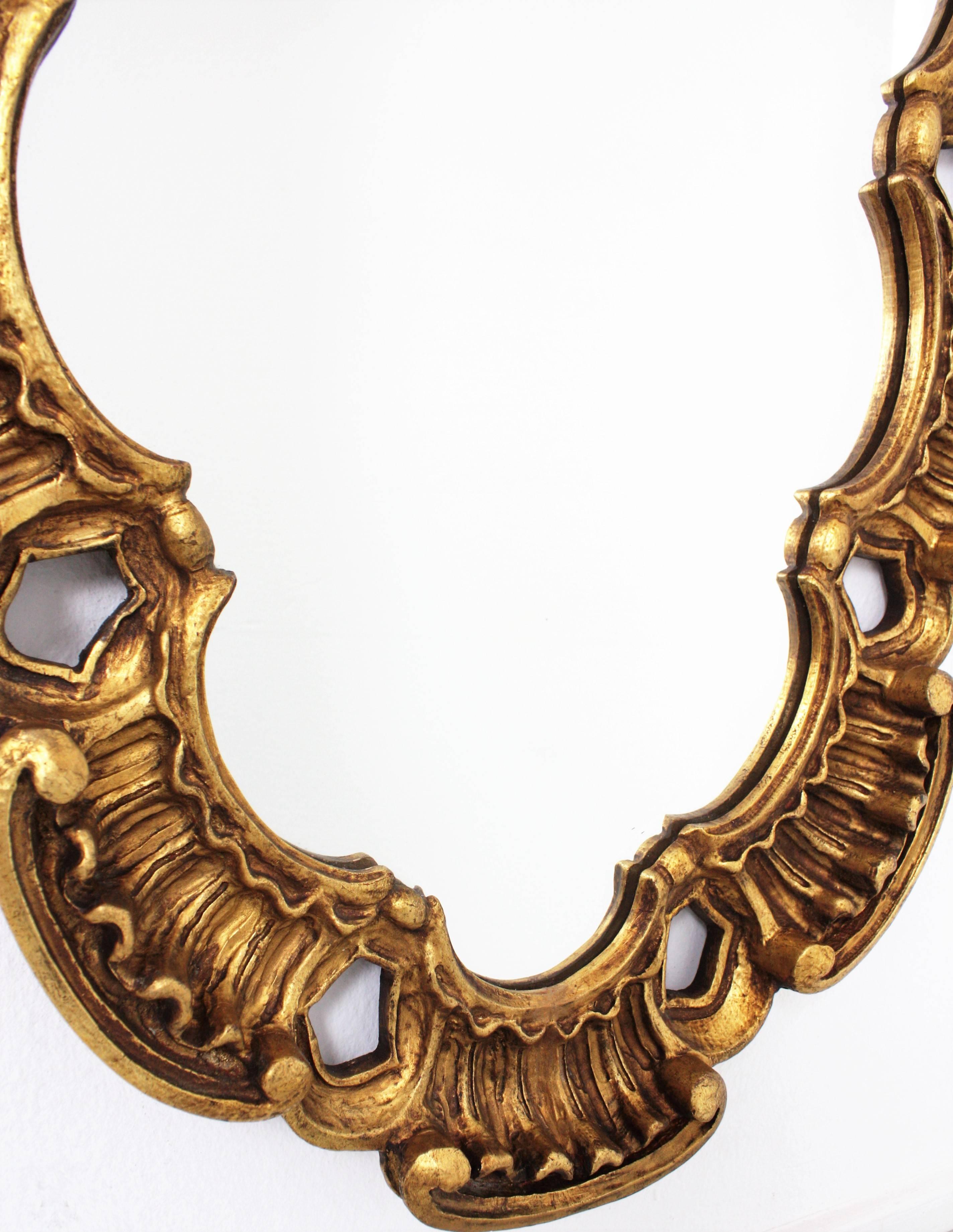 Hand-Crafted Spanish Gilt Carved Wood Oval Mirror by Francisco Hurtado, 1950s For Sale
