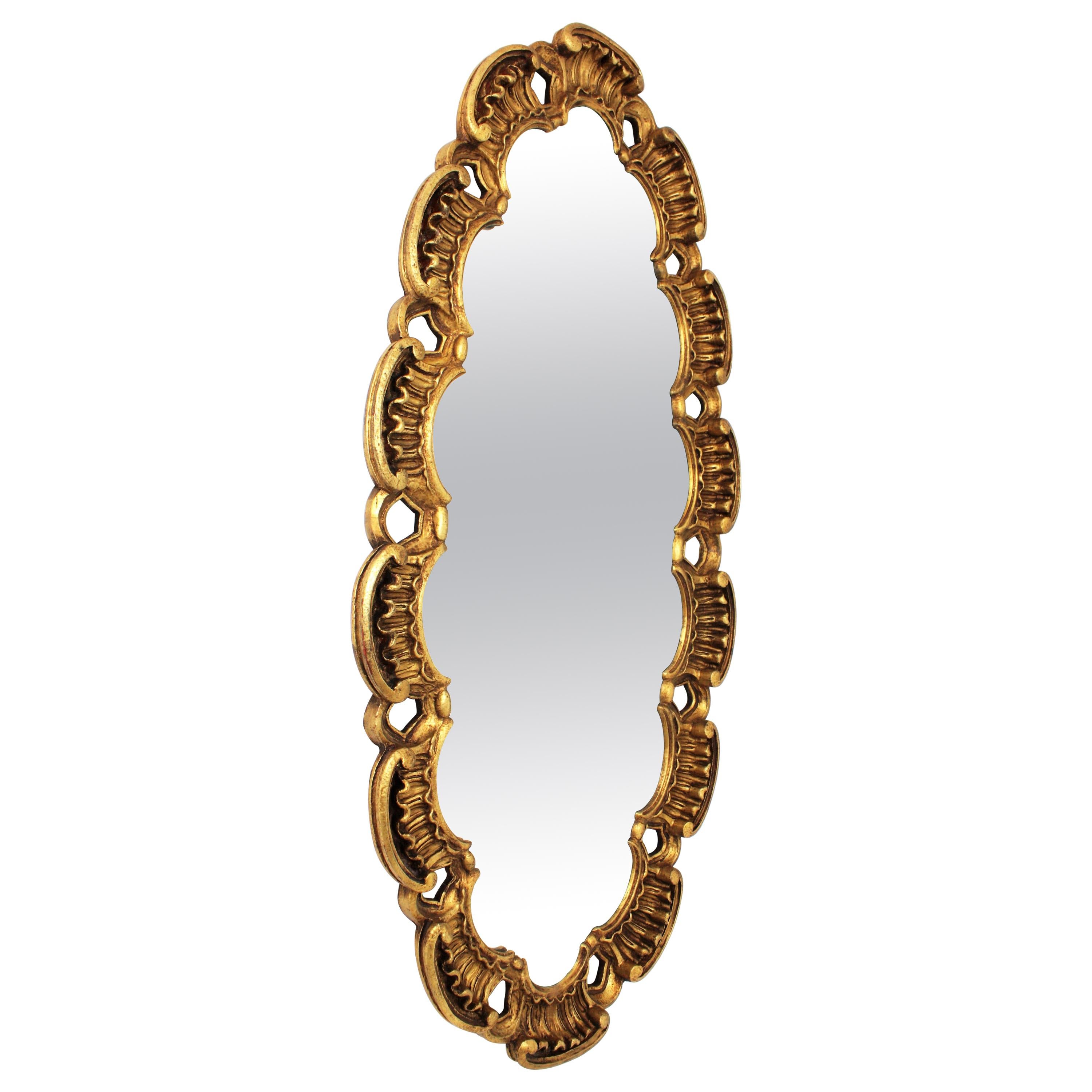 Francisco Hurtado Scrollwork Giltwood Carved Oval Mirror
One of a kind giltwood carved oval mirror with a highly decorative scalloped scroll-work frame. Manufactured by Francisco Hurtado, Spain, 1950-1960.
Francisco Hurtado was an Spanish cabinet
