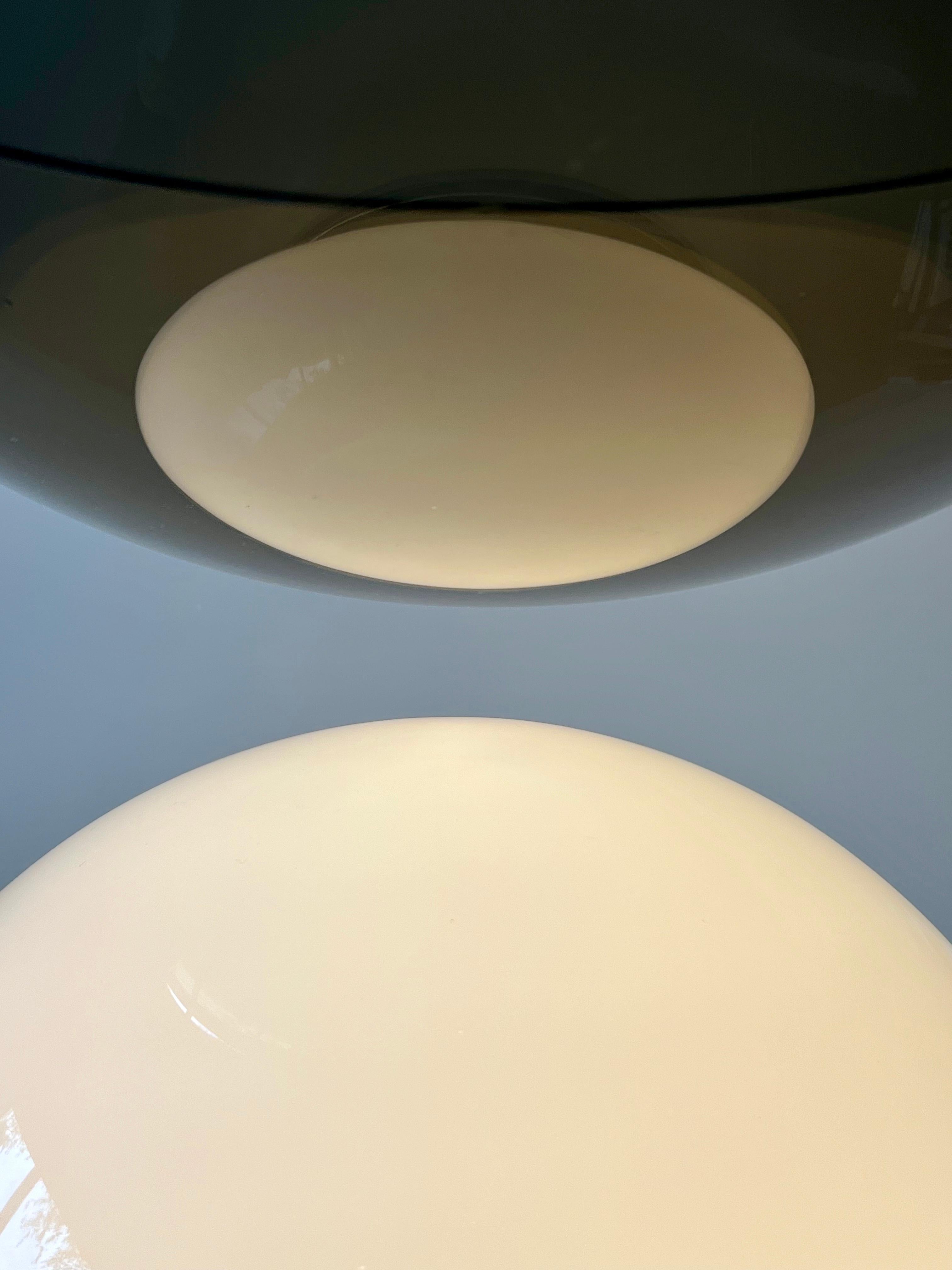 Is it a lamp, is it a vase? The Giova marks Gae Aulenti debut in the field of designer lighting. A luminous sculpture in glass that functions as a centerpiece in your interior.
 
This first edition Giova has a chromed metal base and can easily be