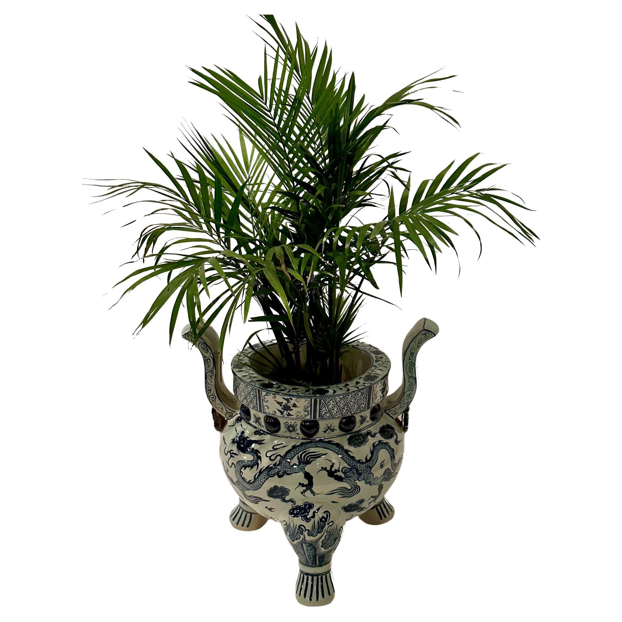 Big glamorous two handled urn or planter having a beautiful shape and classic blue and white design.  Opening is 10