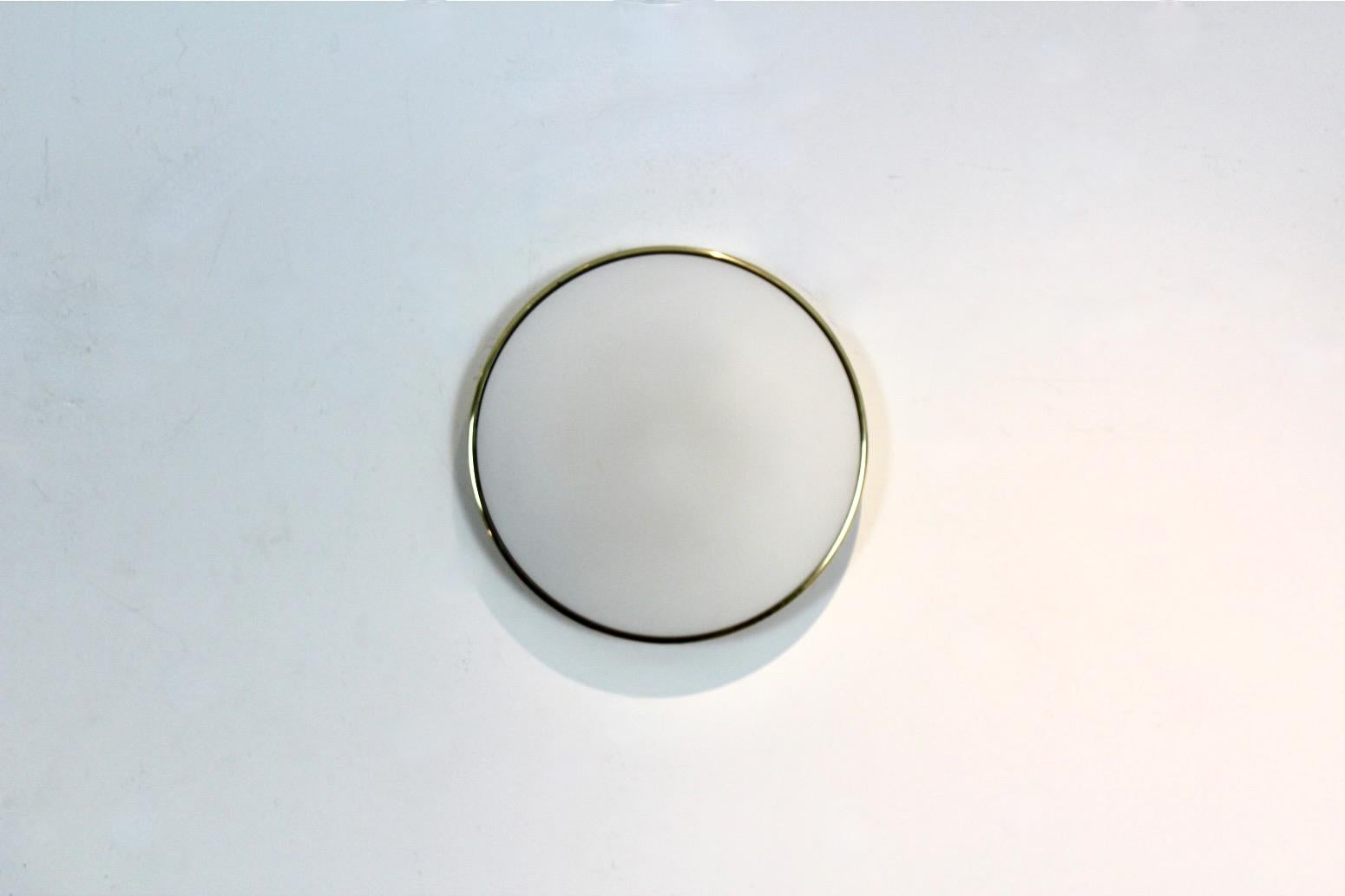 Beautiful high quality and characteristic Glashütte Limburg Wall Light. We have a stock of 9 pieces available. An example of Limburg's Modernist quality lighting. The lamp has a solid round Brass base fixture with a large Opaline Glass finish. Holds