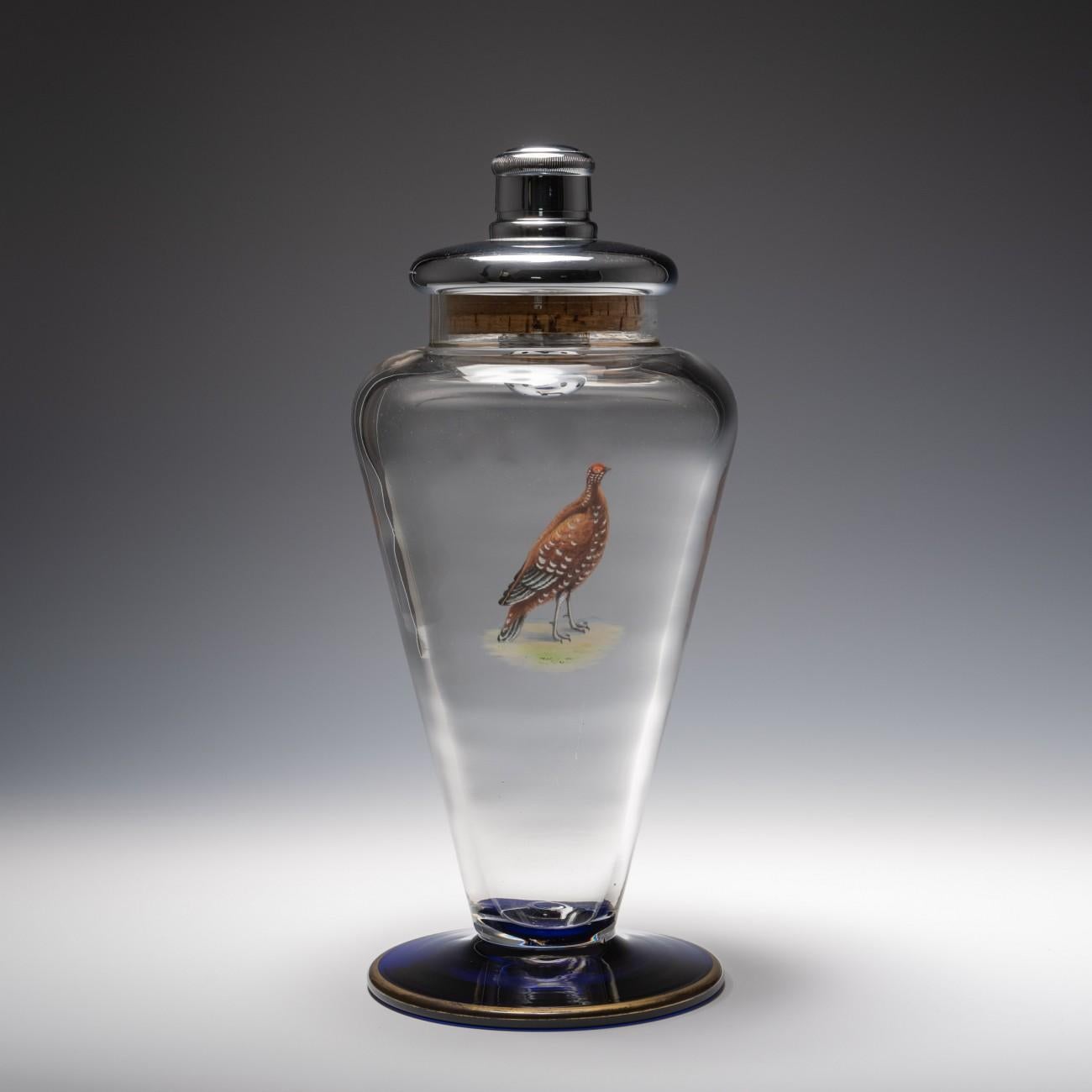 Spectacular cocktail shaker with red grouse motif and cobalt blue base, circa 1940. Top has maker's mark, SL and is stamped chromium-plated. Made in England.

Dimensions: 31 cm/12¼ inches (height) x 14.5 cm/5¾ inches (max diameter)

Bentleys are