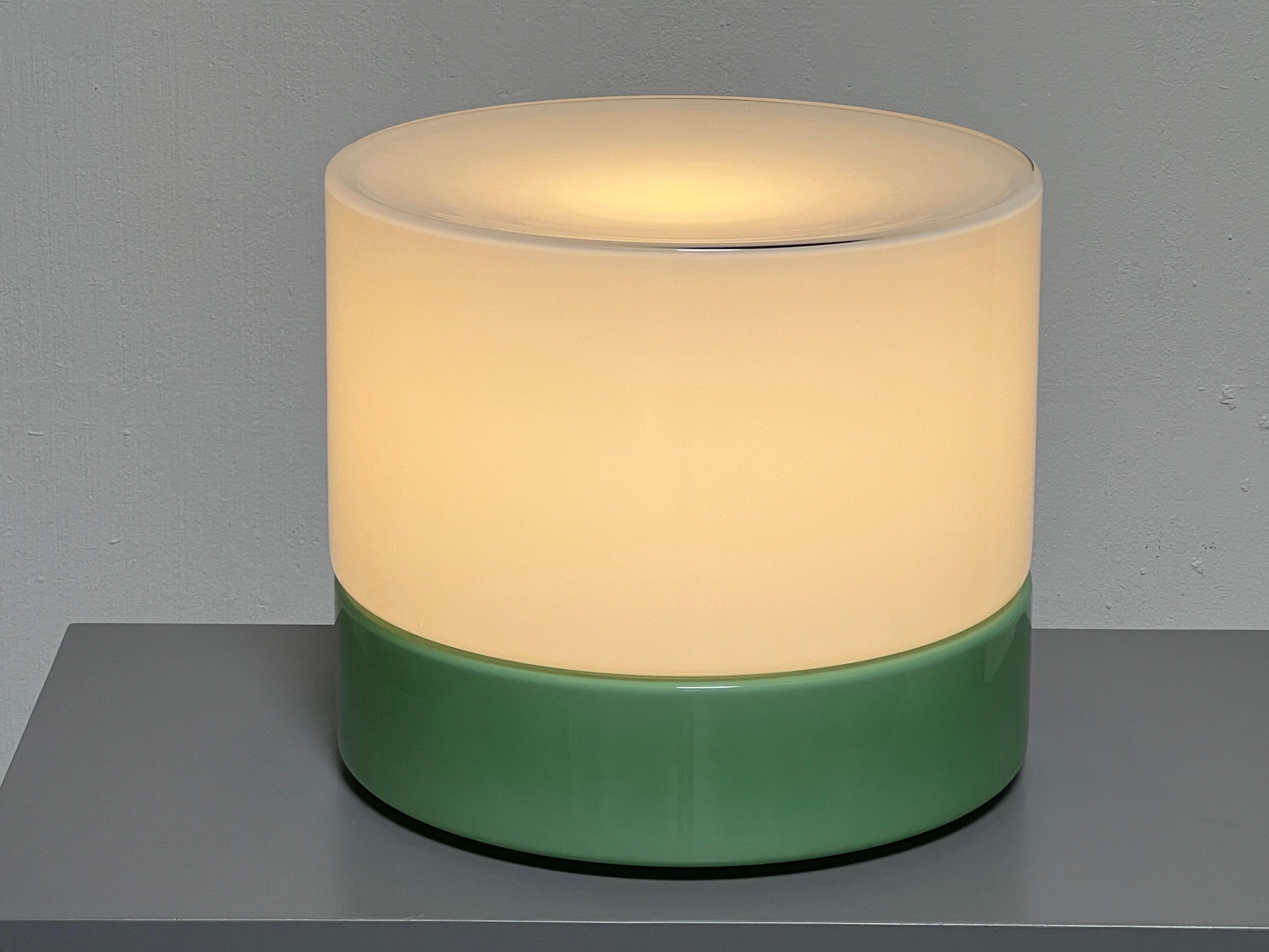 A large two piece floor or table lamp with green glass bottom and white glass top by Vistosi. 