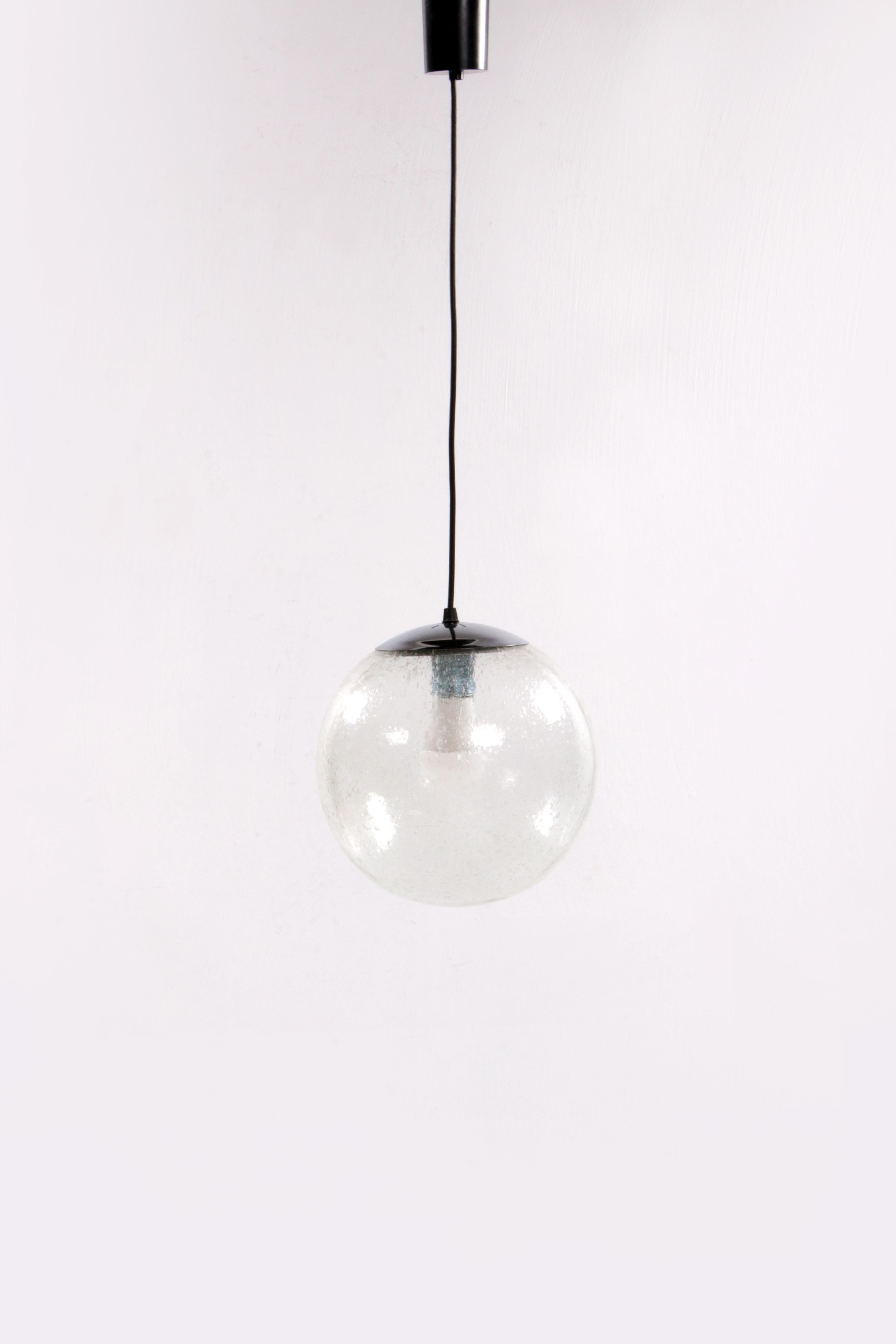 Large Glass Globe Hanging Lamp by Doria Leuchten, 1970s

A beautiful and stylish light object, fits perfectly in a sleek modern interior. The beautiful ice glass spreads the light in a special way.

The lamp comes from the 1970s, and was made by