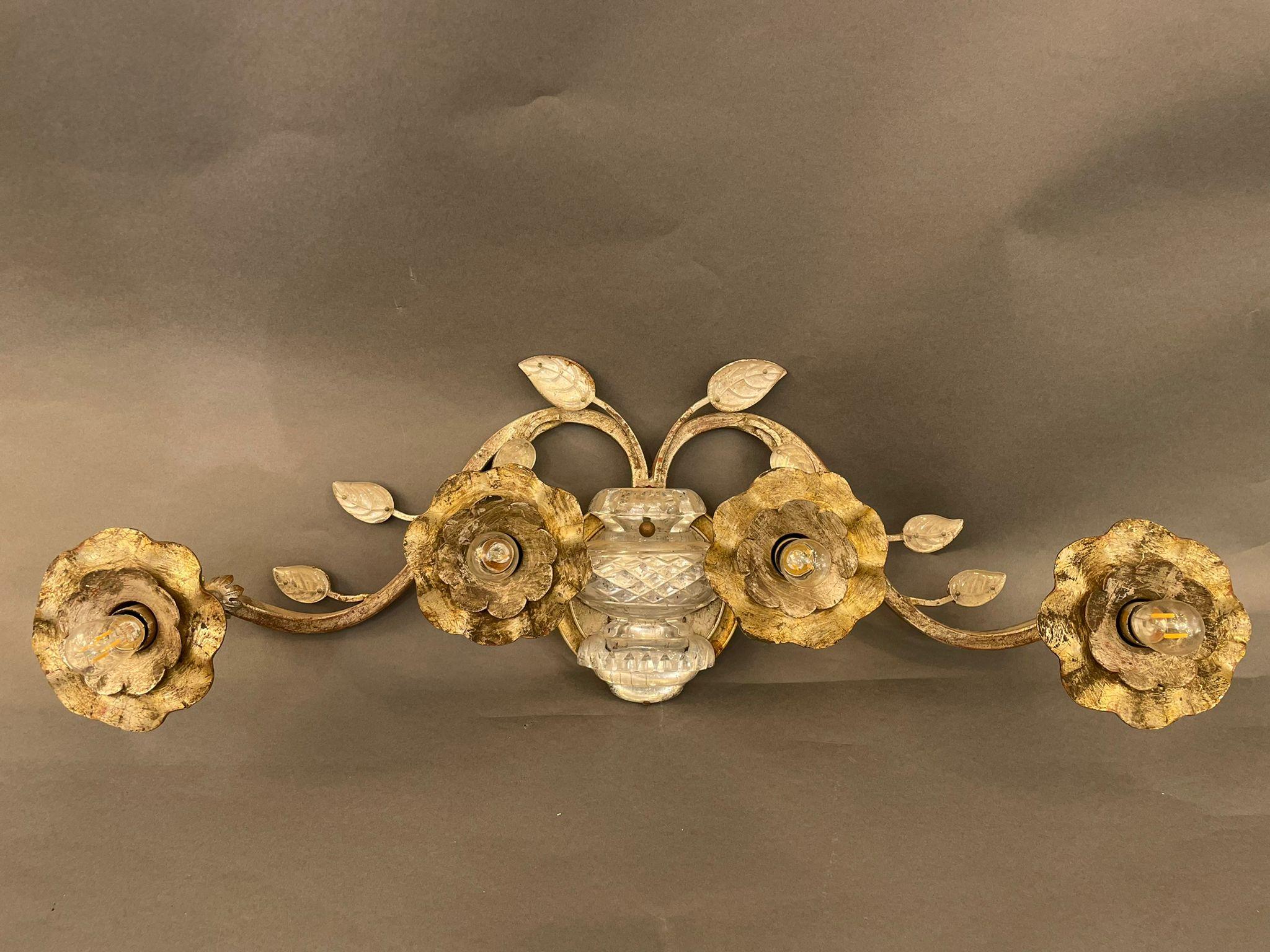 A large French silver Wrought Iron sconces attributed to Maison Bagués. Silver iron painted finish, adorned with flowers and leaves, the side flowers are directional. France 1940s

In excellent vintage condition.