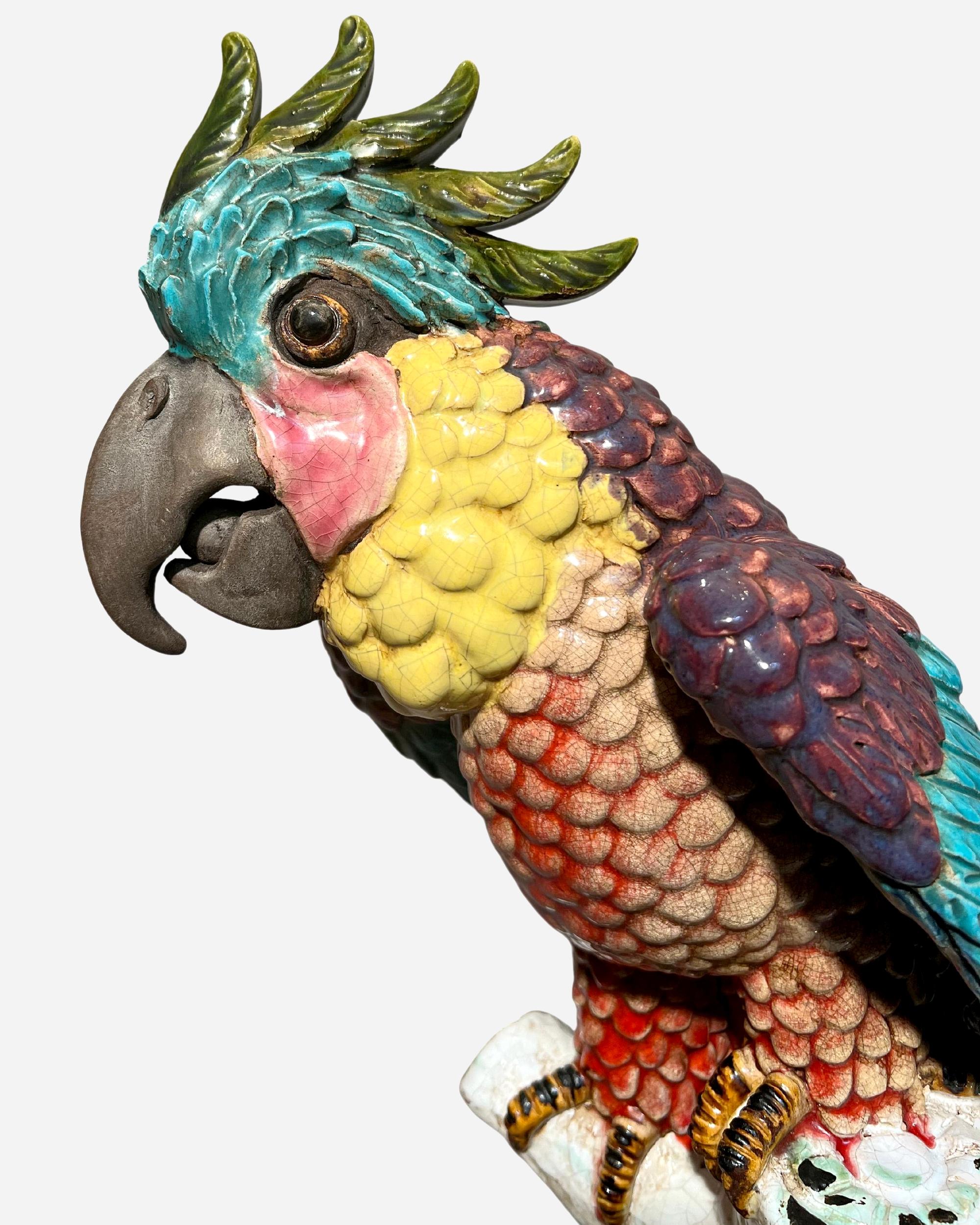 This large, multicolored cockatoo is perched on a tree trunk surrounded by bamboo and rocks.
Signature and stamp on base.
Height: 76 cm (30 inches)
Diameter: 30 cm (11.8 inches)
