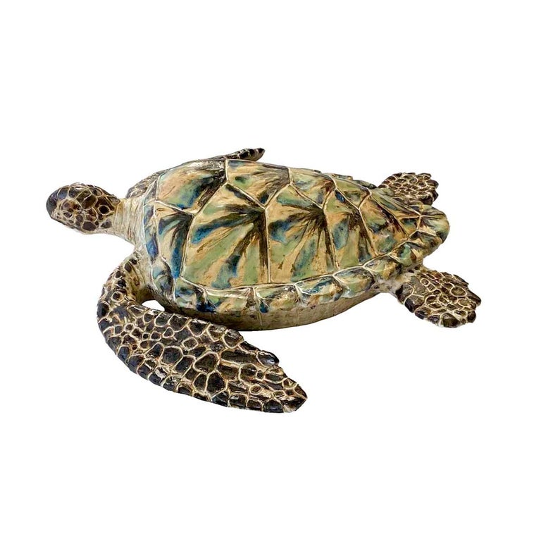 Large hand molded, built and glazed stoneware model of a sea turtle, by Shayne Greco. The life like sculpture glazes in browns, blues, green and ivory and painted to resemble the patterns of natural tortoiseshell. The sculpture is wired to mount on