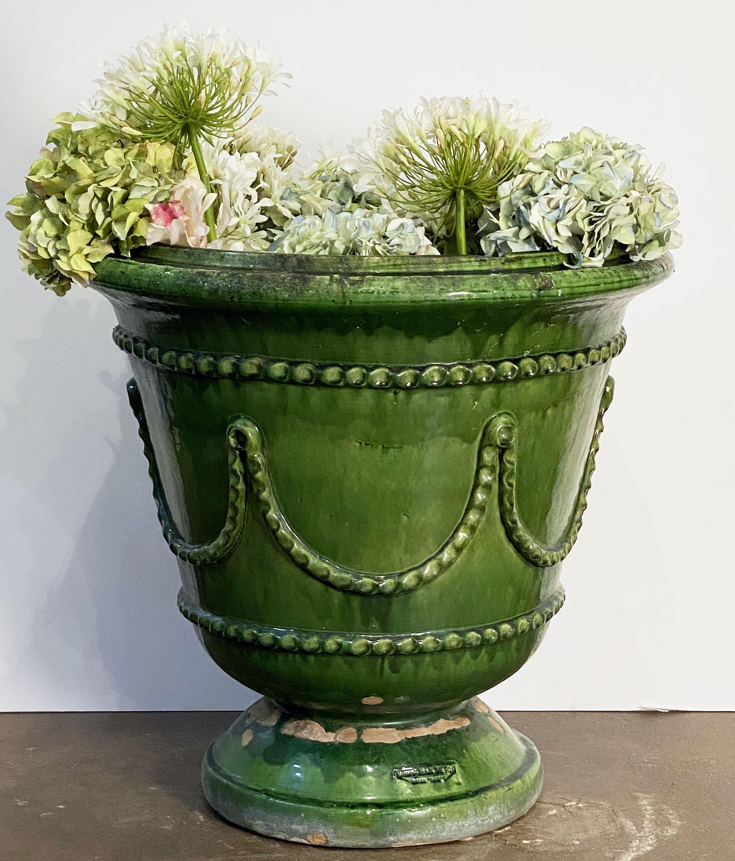 A fine large French garden planter pot or urn featuring the brilliant green-glazed earthenware hues of Castelnaudary pottery and a stylish relief design around the whole.

With impressed pottery marks on interior and at base - POTERIE DES GORGES