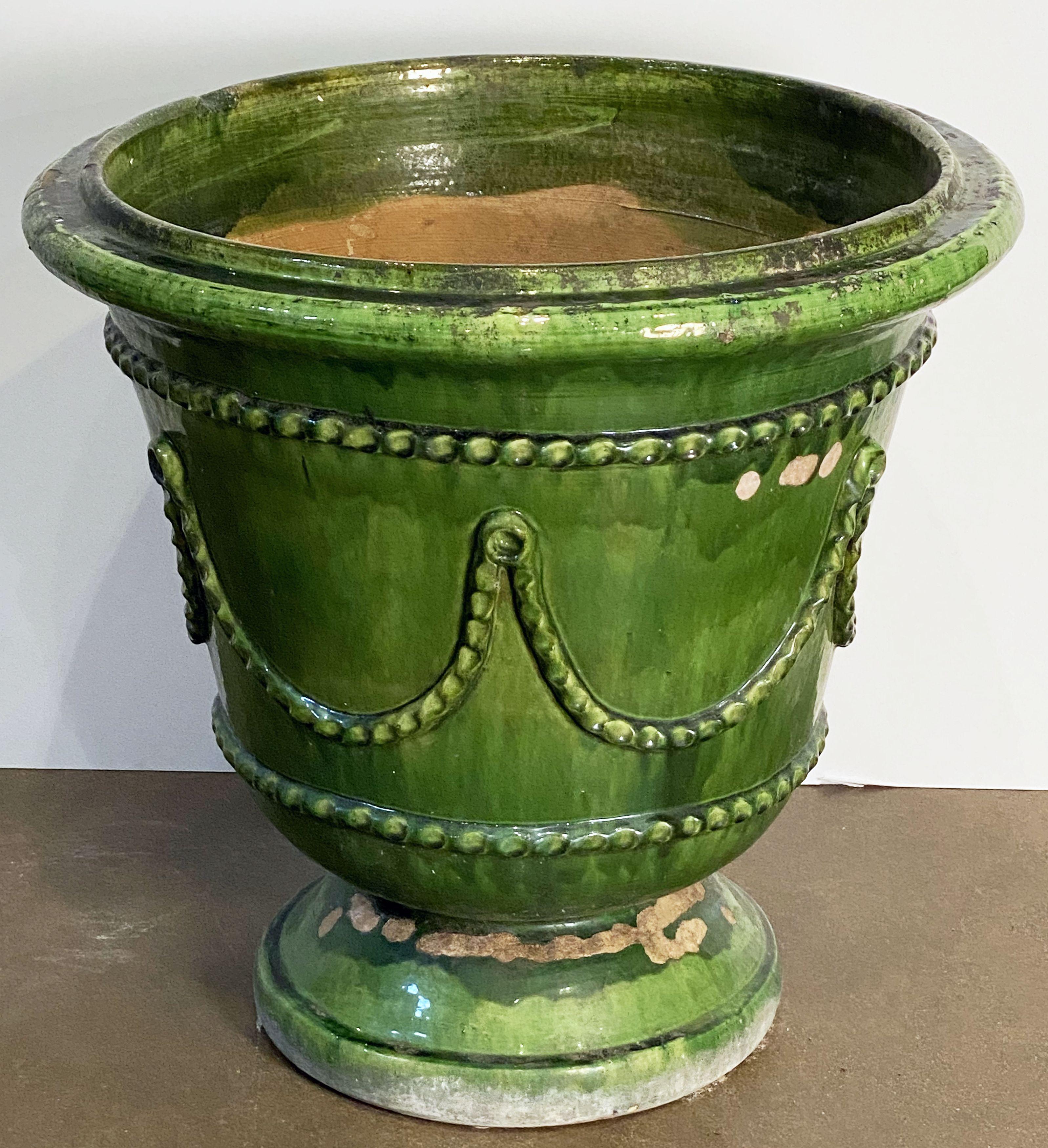 green urn planter