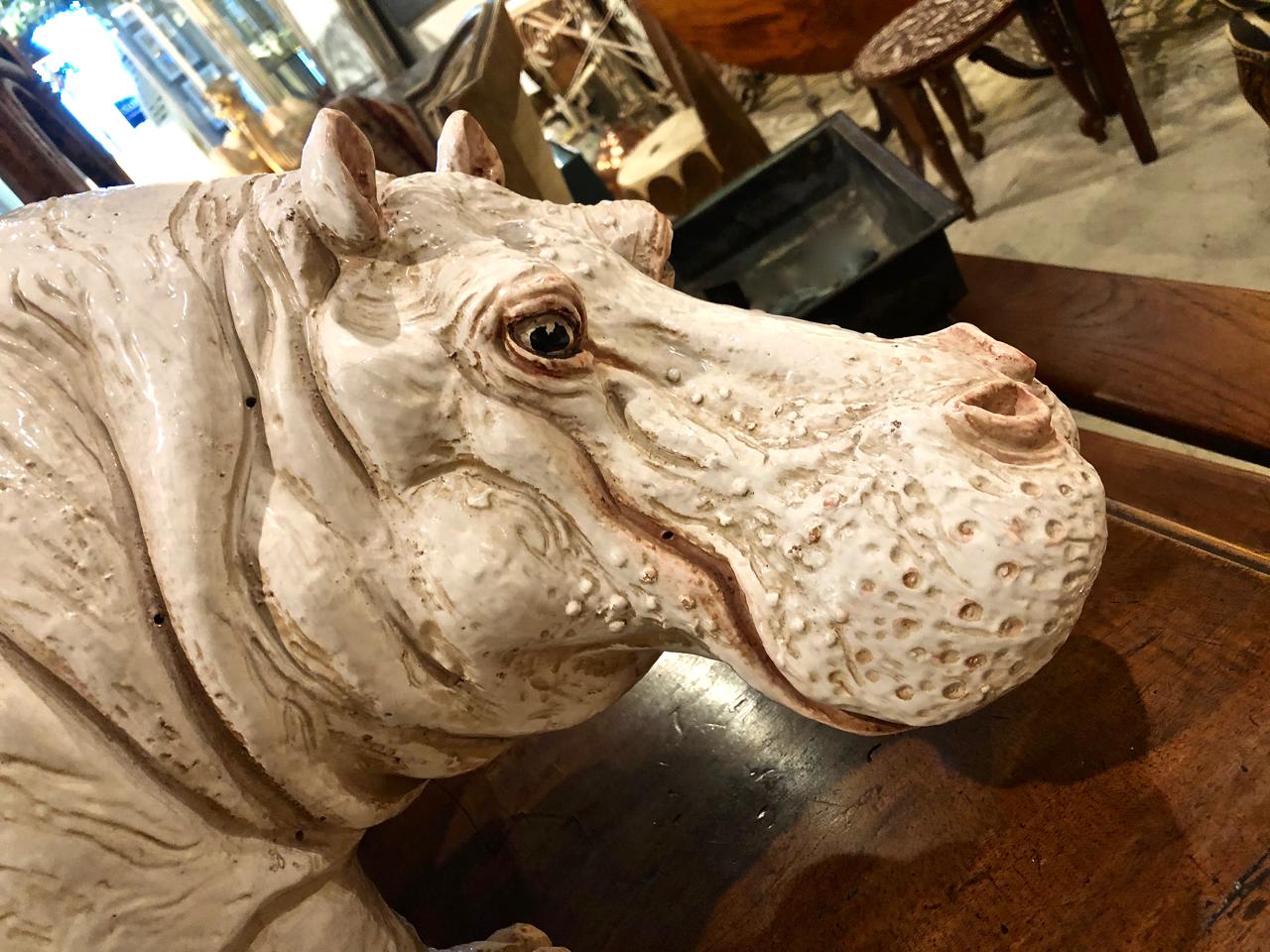 This a wonderfully realistic ceramic sculpture of a hippopotamus. This is an unusually large figure that is beautifully detailed, i think she's a girl because of her soulful eyes. She would incorporate well into multiple design projects.
   