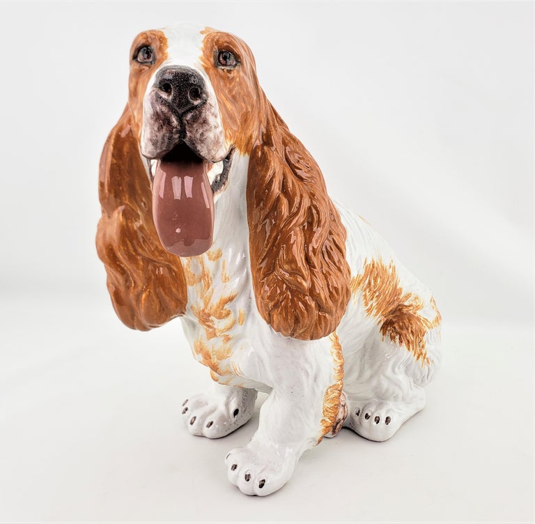 This large, possibly life sized glazed terracotta dog sculpture is unsigned with respect to the artist, but is presumed to have been made in Italy in approximately 1969 in a very realistic style. The sculpture is done with a molded terracotta clay