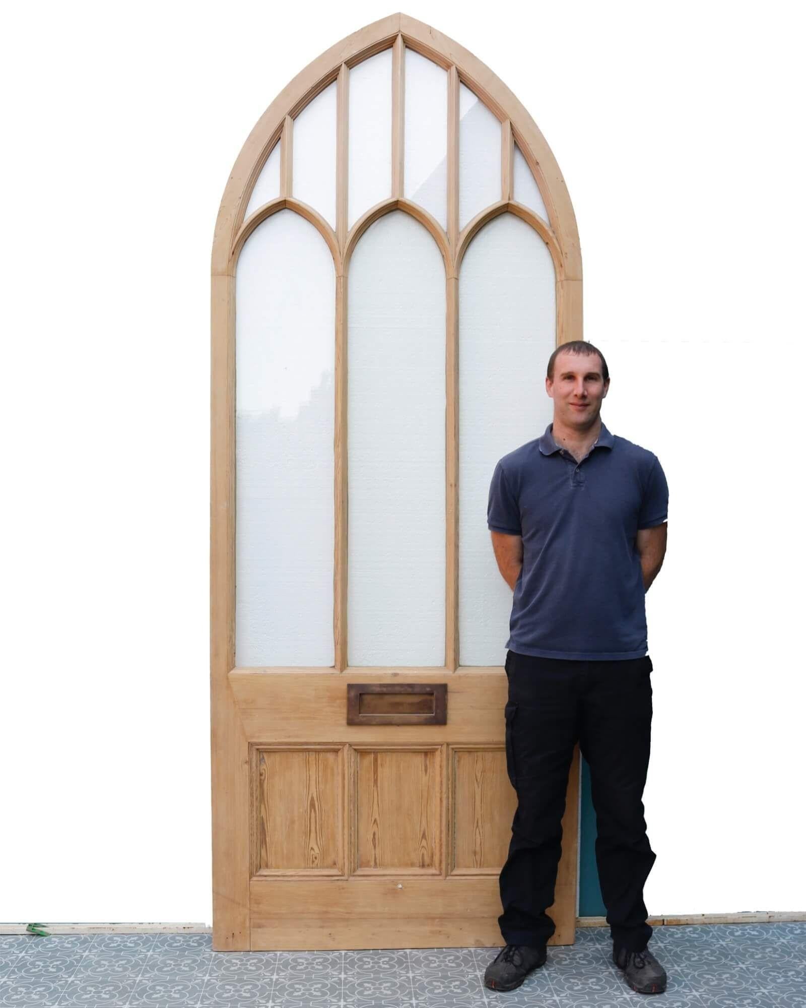 Dating from 19th century England, this large glazed Victorian arched door is a stunning feature for properties period and modern. It was reclaimed from a Victorian orangery and as such features large, elongated single glazed, clear glass windows and