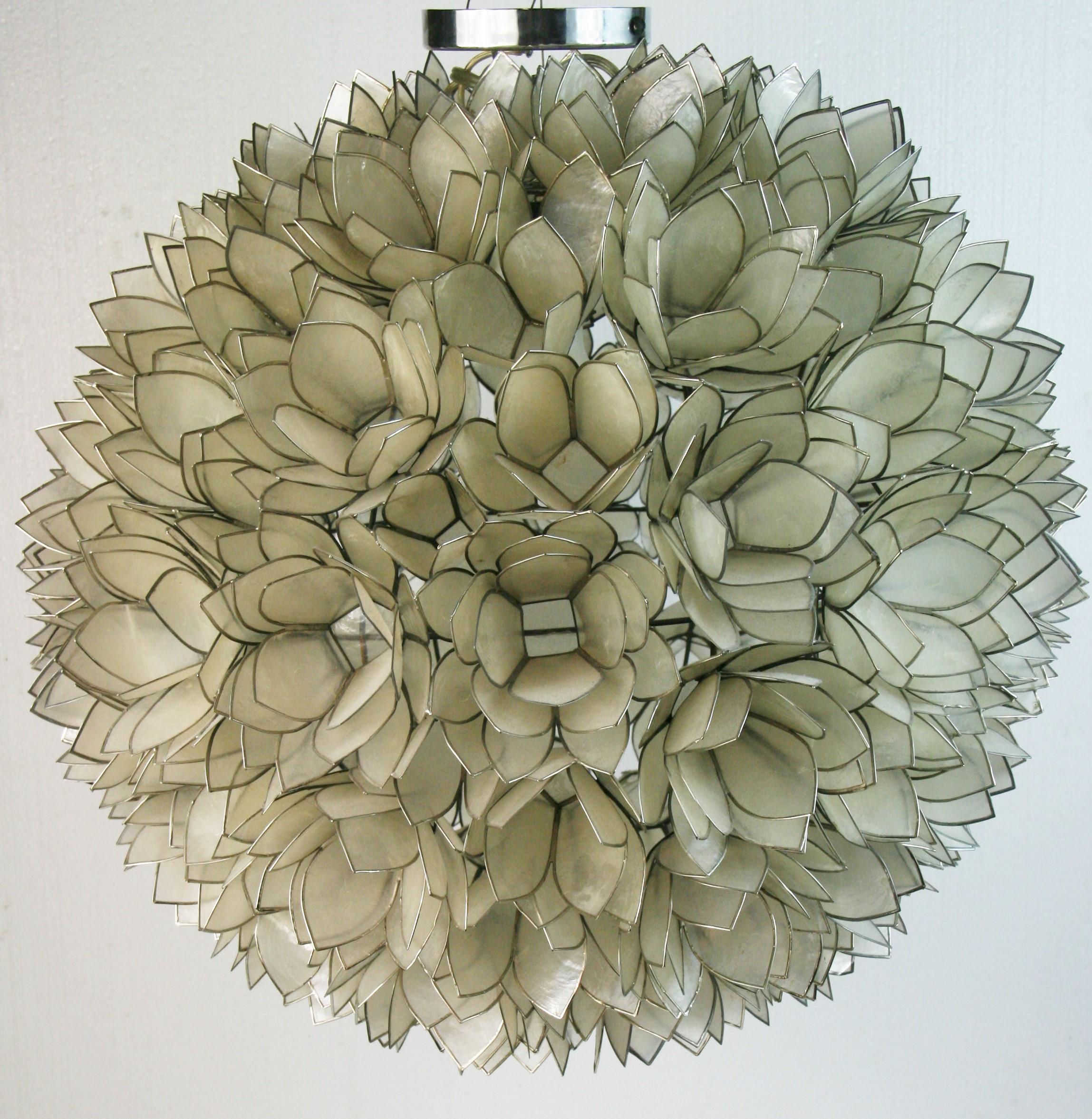 1674 Large globe shaped Capiz shell  mother of pearl chandelier with lotus flower pattern with nickel edging
Takes on 100 watt edison based bulb