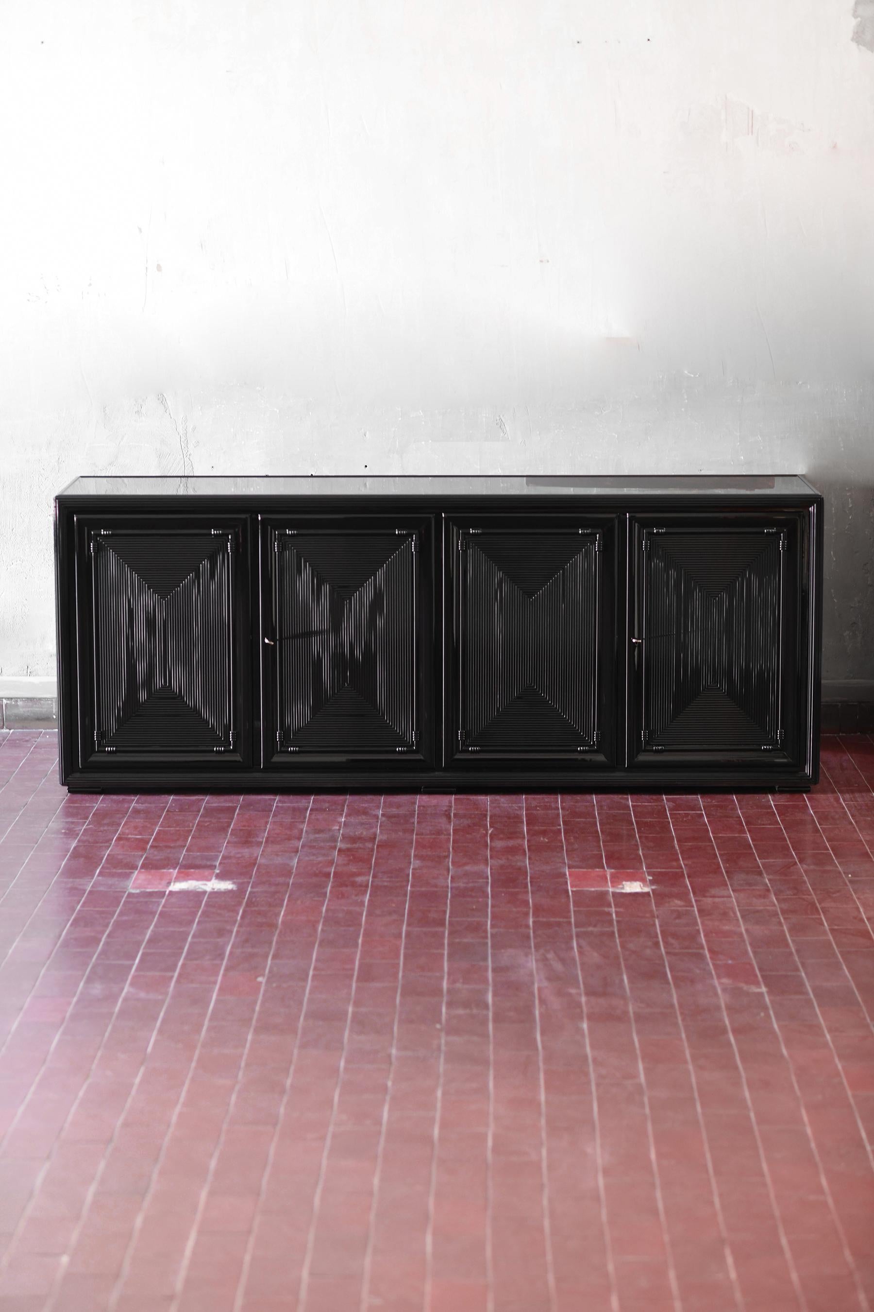 Large glossy black lacquered sideboard.
Storage unit with doors, drawers and internal shelves
Product details
Dimensions 200 W x 73 H x 50 D cm