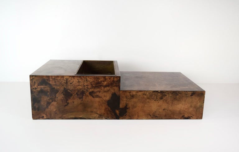 Truly impressive Coffee Table by Aldo Tura in Lacquered Goatskin. The Milanese artist Aldo Tura is well known for these exquisit and exclusive coffee tables. This table is bronze colored and in excellent condition. It has two layers and a brass