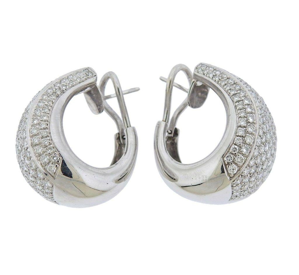 Pair of Italian-made 18k gold half hoop earring with approx. 3.80ctw in FG/VS diamonds. Not Signed. Earrings are 25mm long x 17.5mm at widest point. 18.9 grams total weight. Marked 750, Italian mark.