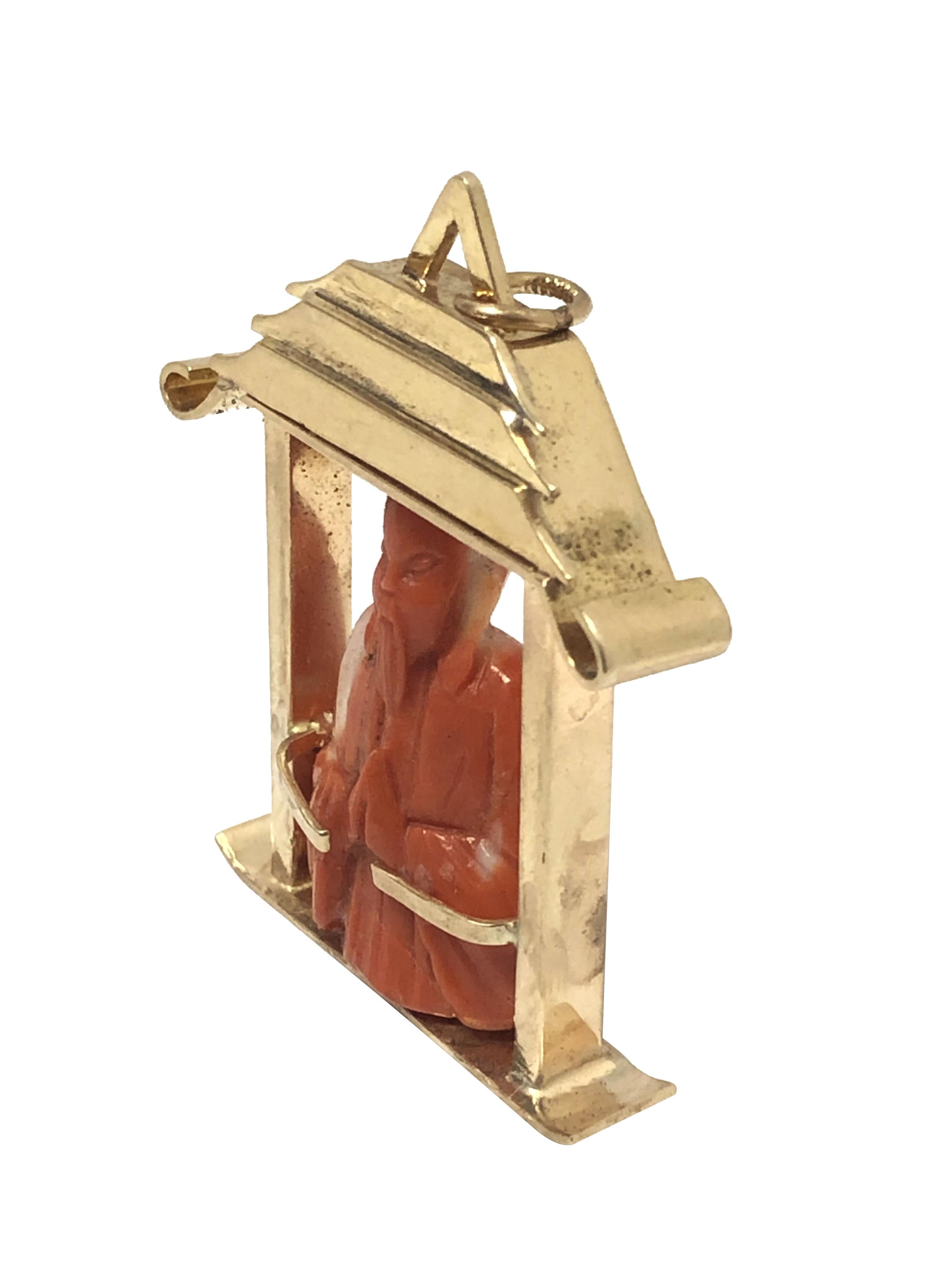 Cabochon Large Gold and Carved Coral Art Deco Confucius in a Pagoda Charm Pendant For Sale