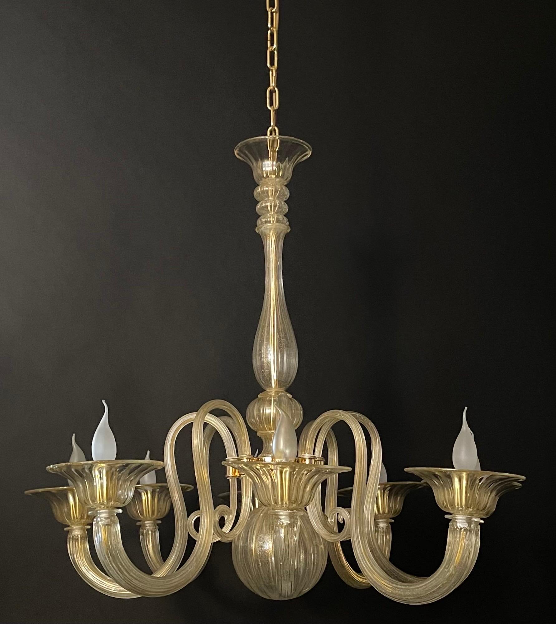 A large gold dusted Murano glass and 24 karat gold - plated brass chandelier by  Barovier Toso, Italy, circa 1960s.
Socket: 8 x e14 for standards screw bulbs.
 