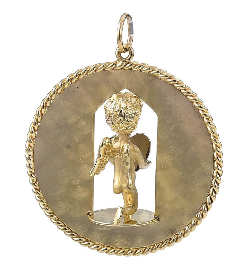 Great charm:  a large round disc with a cut-out center.  The center figure is a figural three-dimensional 
