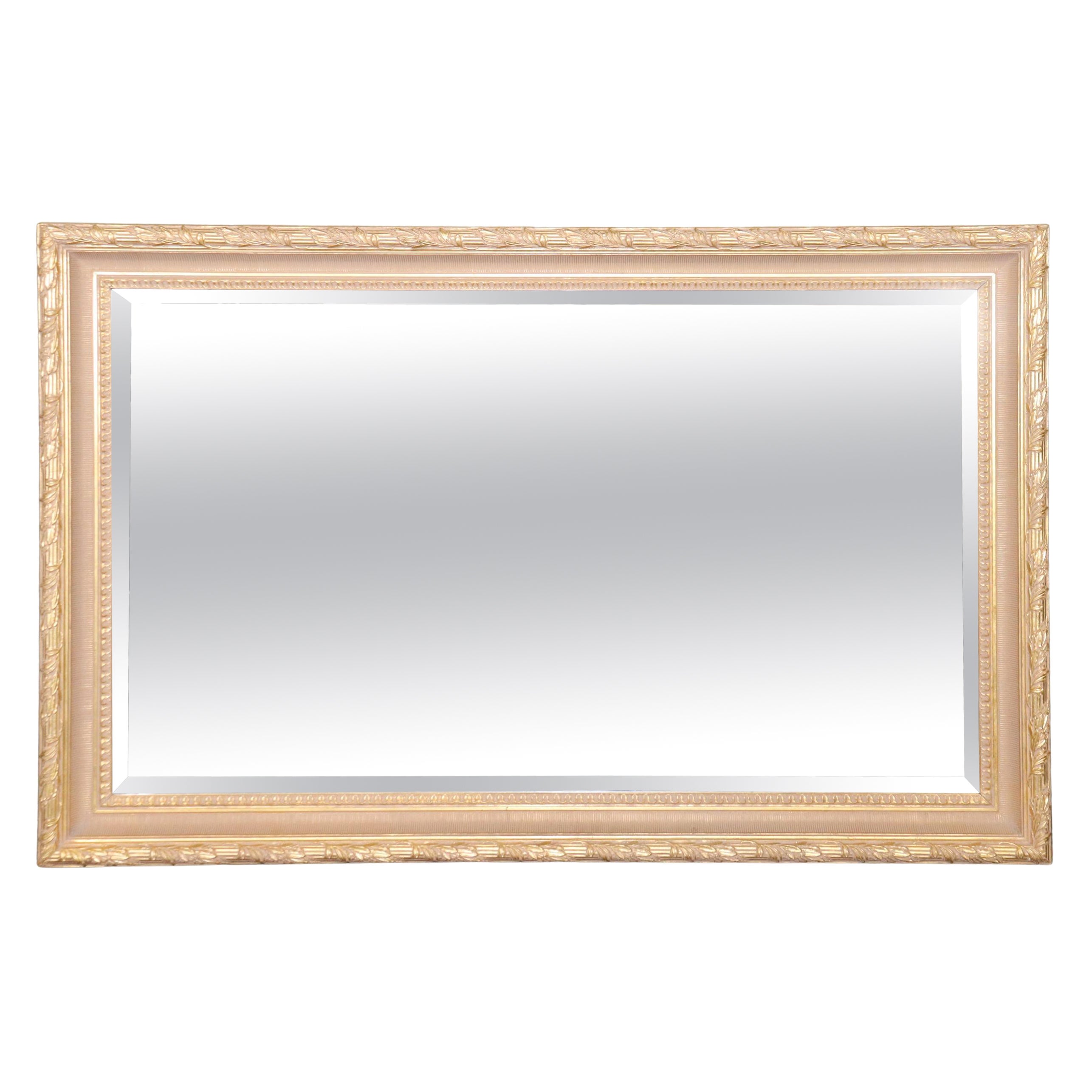 Grand miroir en verre biseauté doré par Labarge