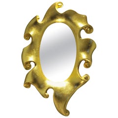 Grande specchio d
oro dorato decorativo vintage a volute