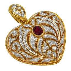 Large Gold Hand Pierced Diamond Encrusted Puffed Heart Pendant with Ruby Center