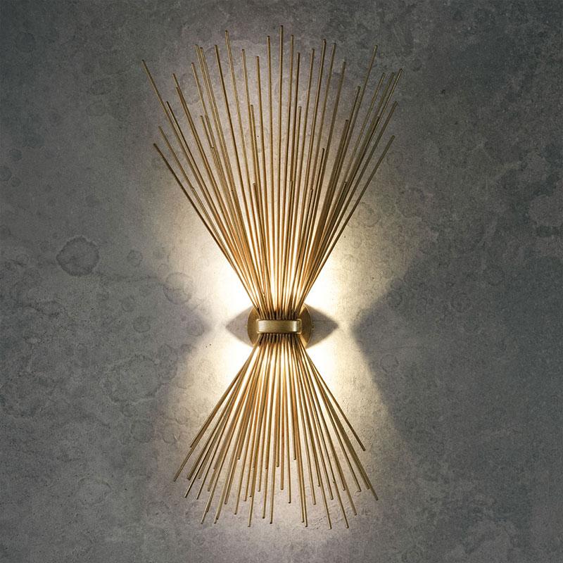Bright, sparkling and large Metal Art Deco style wall light, precious and high quality composed of an aerial metal structure in gold leaf finish.