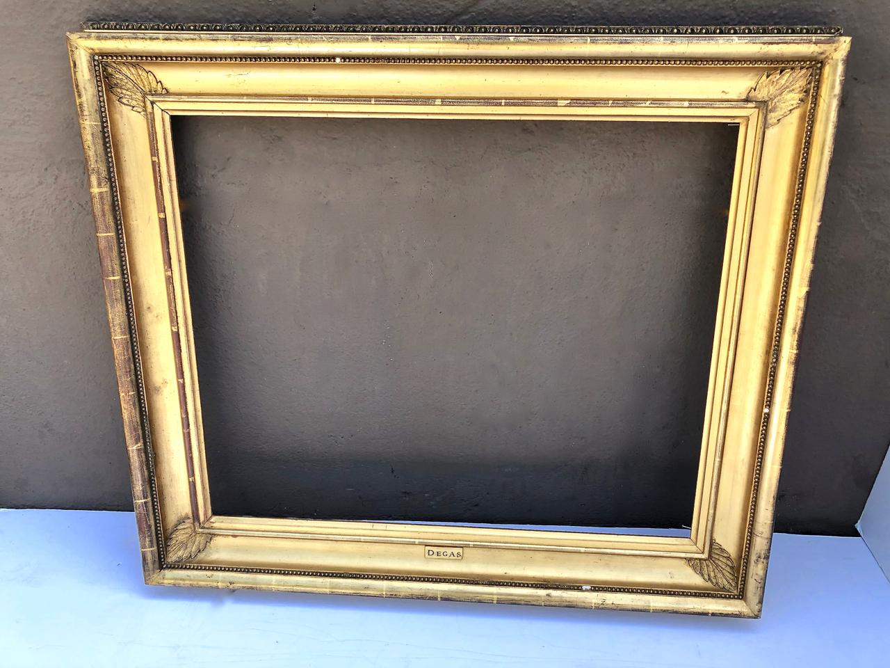 This is a good example of a large gold leafed picture frame dating to circa 1870. The frame is in excellent condition with normal patination. At the lower center of the frame is a gilt plaque inscribed 
