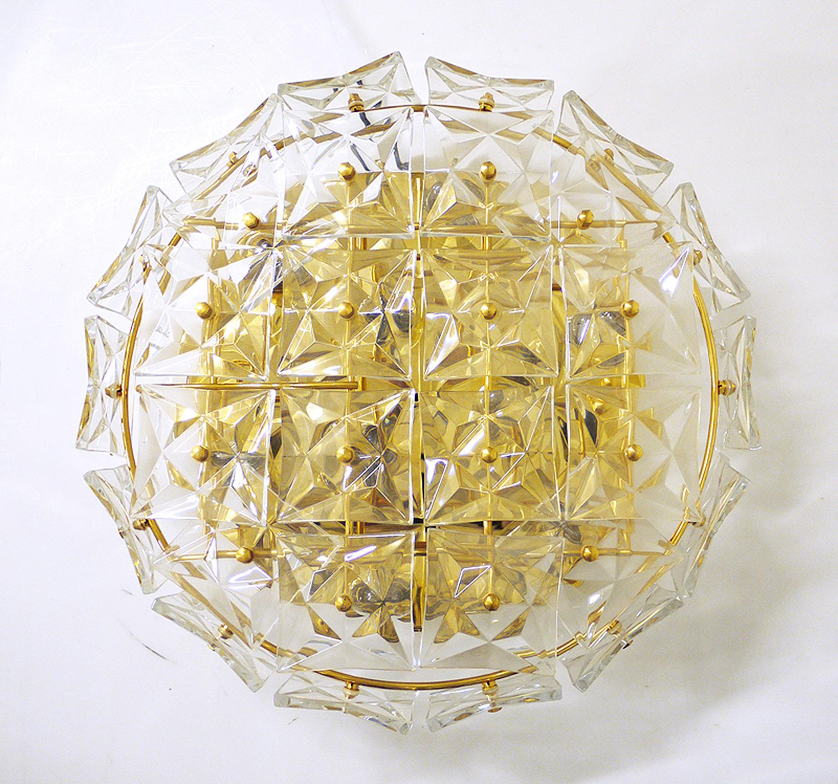 Elegant large flush mount with faceted crystal glass on a gold-plated brass frame. Manufactured by Kinkeldey, Germany in the 1960s. 

Measures: diameter 20“ in. (50 cm), height 6“ in. (15 cm). 
Lighting: takes nine small Edison E14 base screw bulbs.