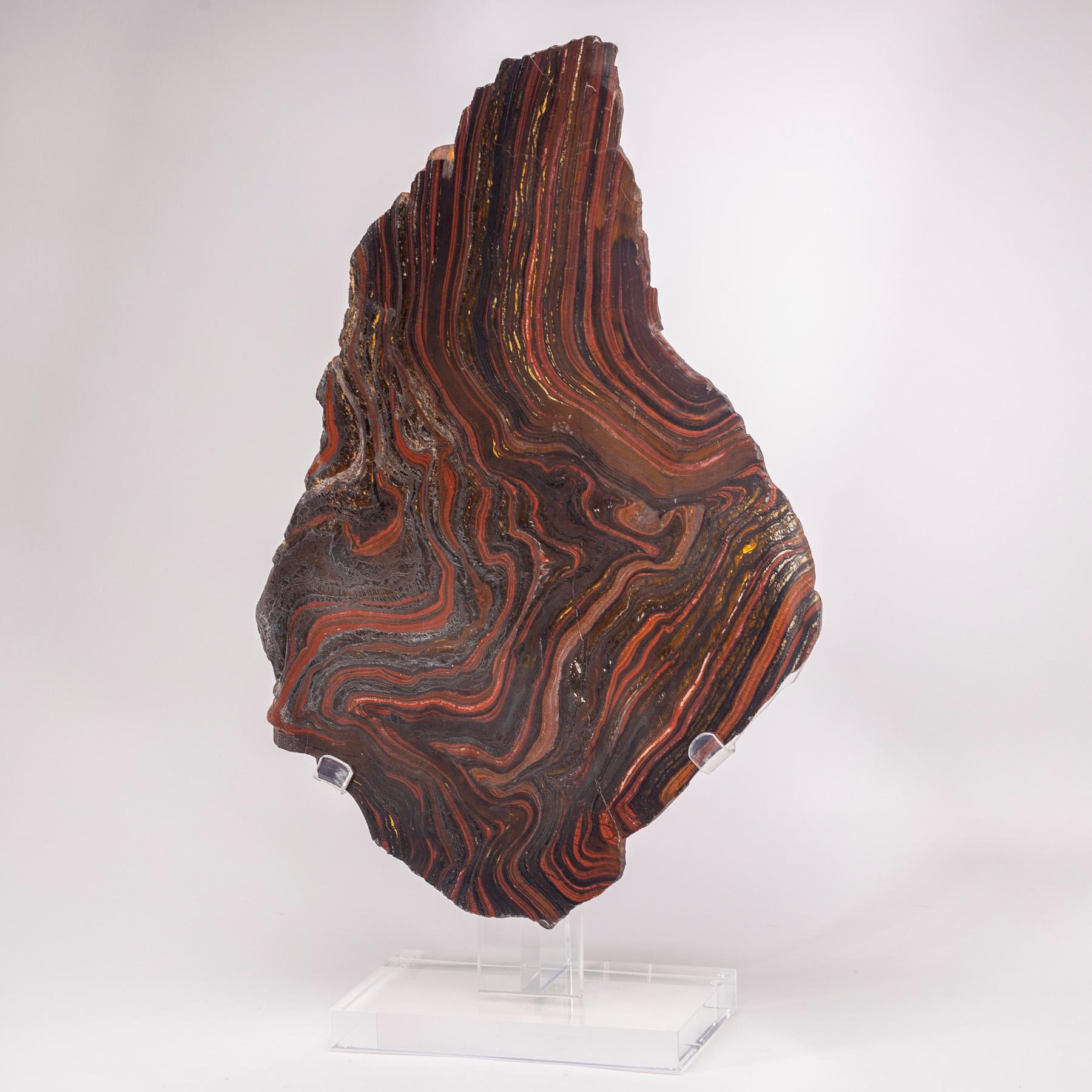 Beautiful Banded Tiger- Iron slab from South Africa

It´s a combination of Gold Tiger Eye, Hematite and Red Jasper. Its name refers to the composition of the stone, Tiger Eye and Hematite which is a stone rich in iron.
 