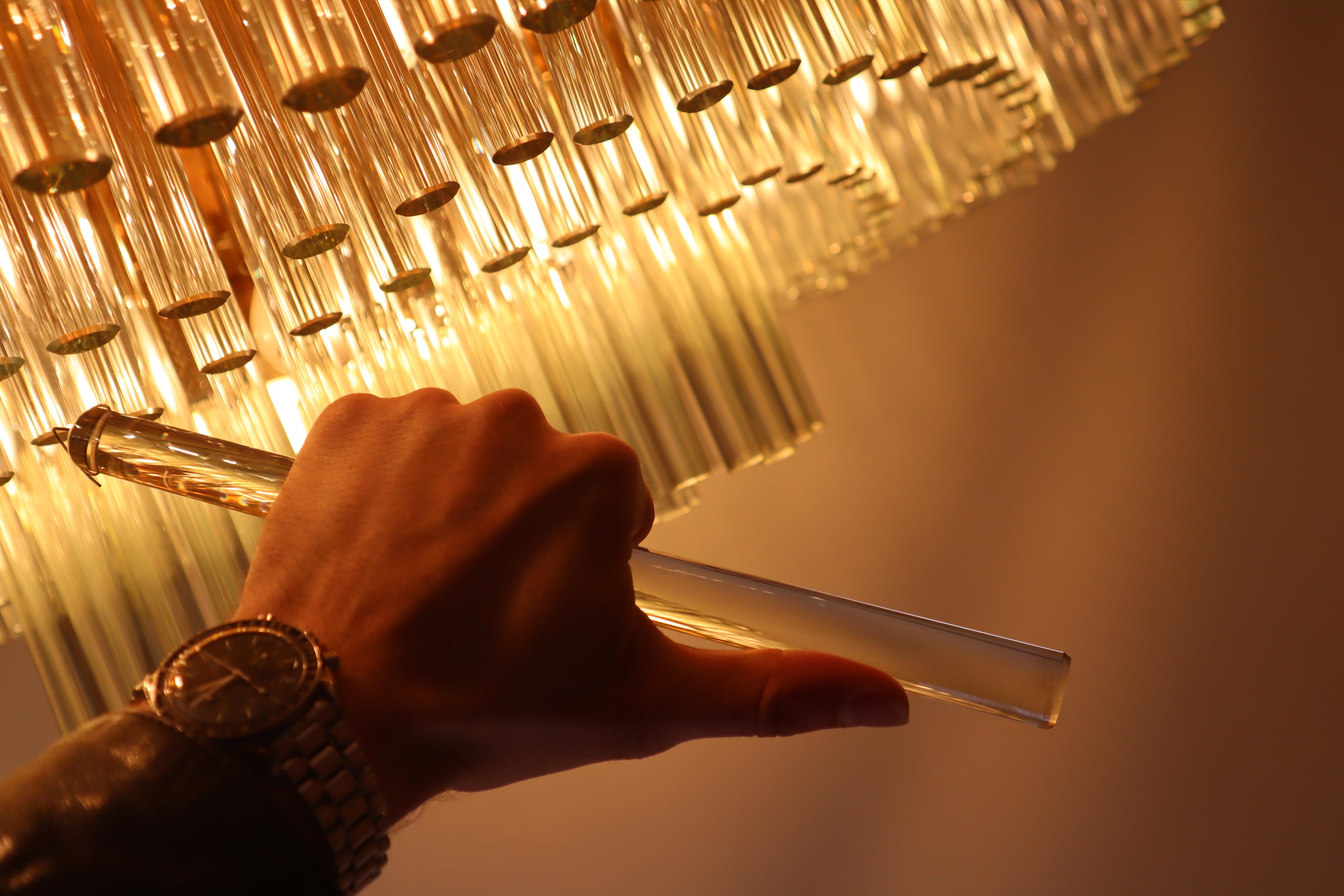 This huge chandelier by Palwa used to hang in the ballroom of a hotel.
 Hand-cut crystal rods and a variety of bulbs make this chandelier unique. A quality that seeks its equal. 
With a diameter of almost one meter, the chandelier is also ideal for