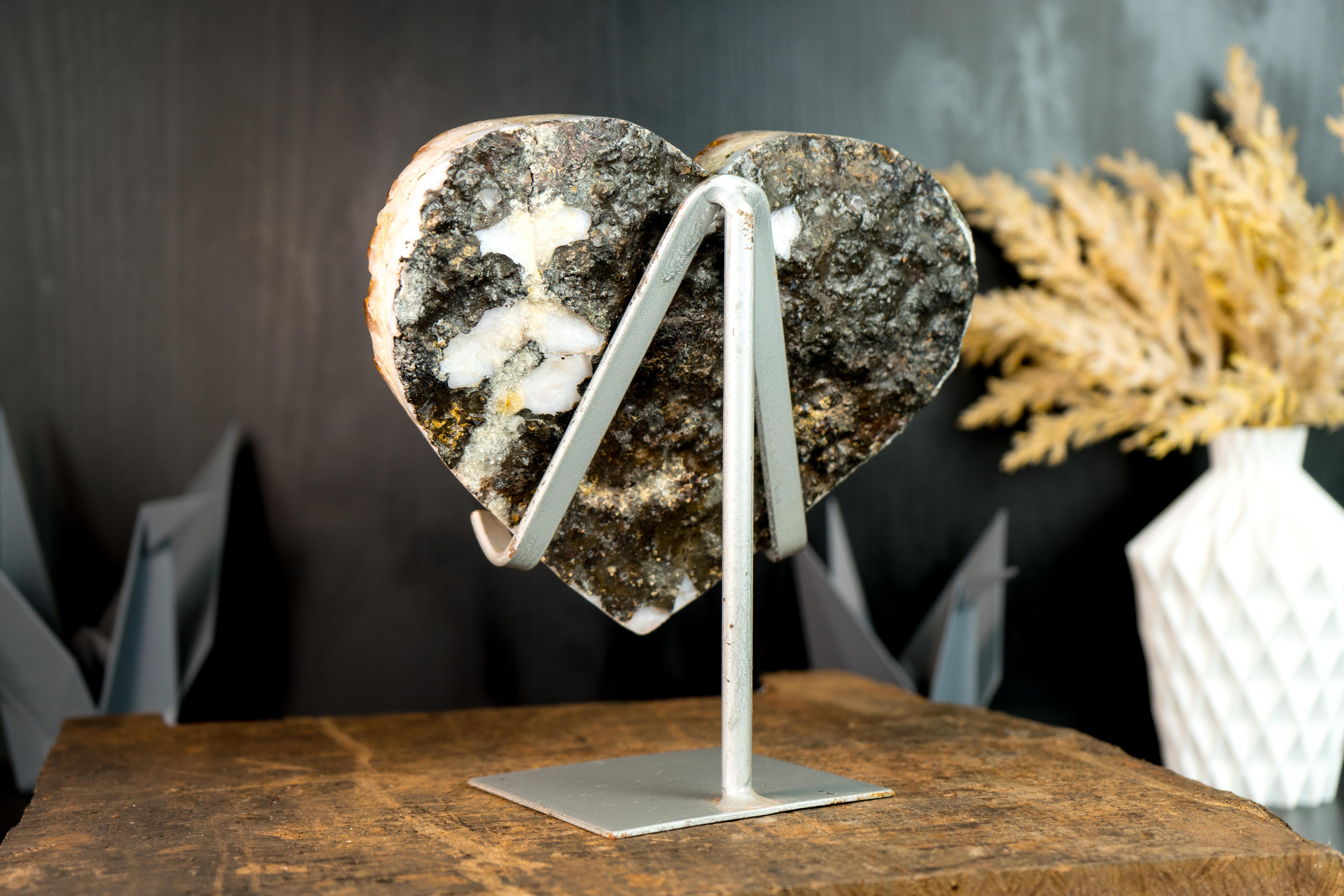 Carefully hand-carved from a single Citrine cluster, this radiant Citrine heart showcases wonderful aesthetics with its sparkly Druzy. It is a Citrine specimen that will become a gorgeous decor piece for your console, desk, or shelf. Additionally,