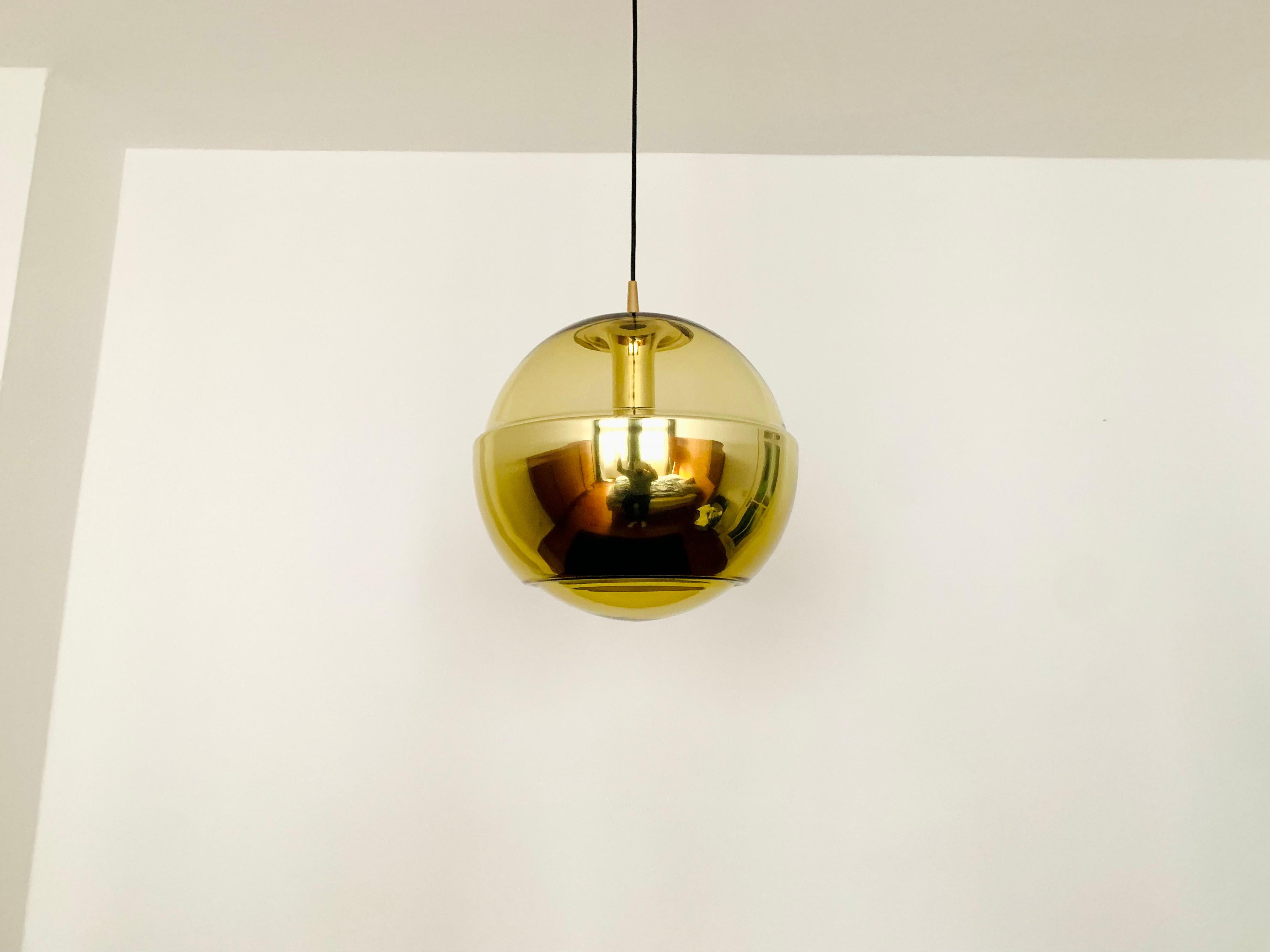 Very beautiful Space Age pendant lamp from the 1960s.
The lamp is very noble and a very special design object.
A spectacular play of light is created.

Manufacturer: Peill and Putzler

Condition:

Very good vintage condition with slight