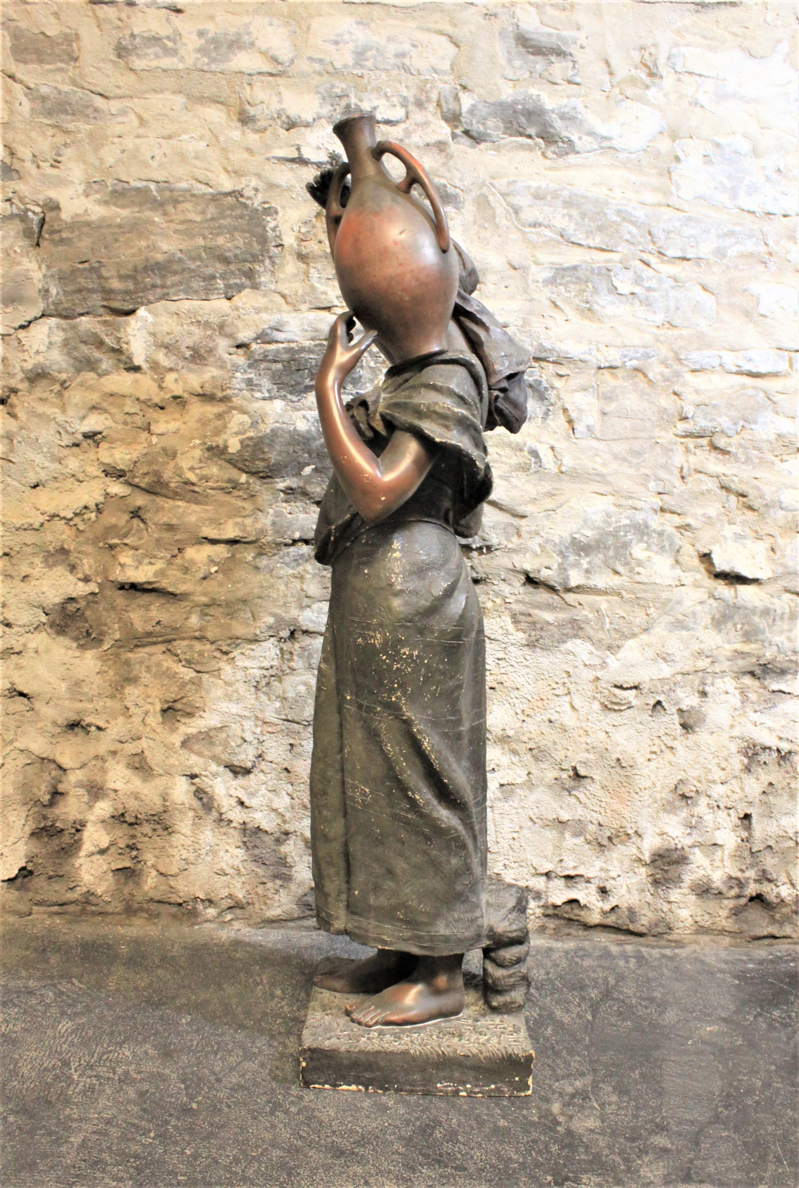 Austrian Large Goldscheider Patinated Terracotta Sculpture of a Woman Carrying Water For Sale