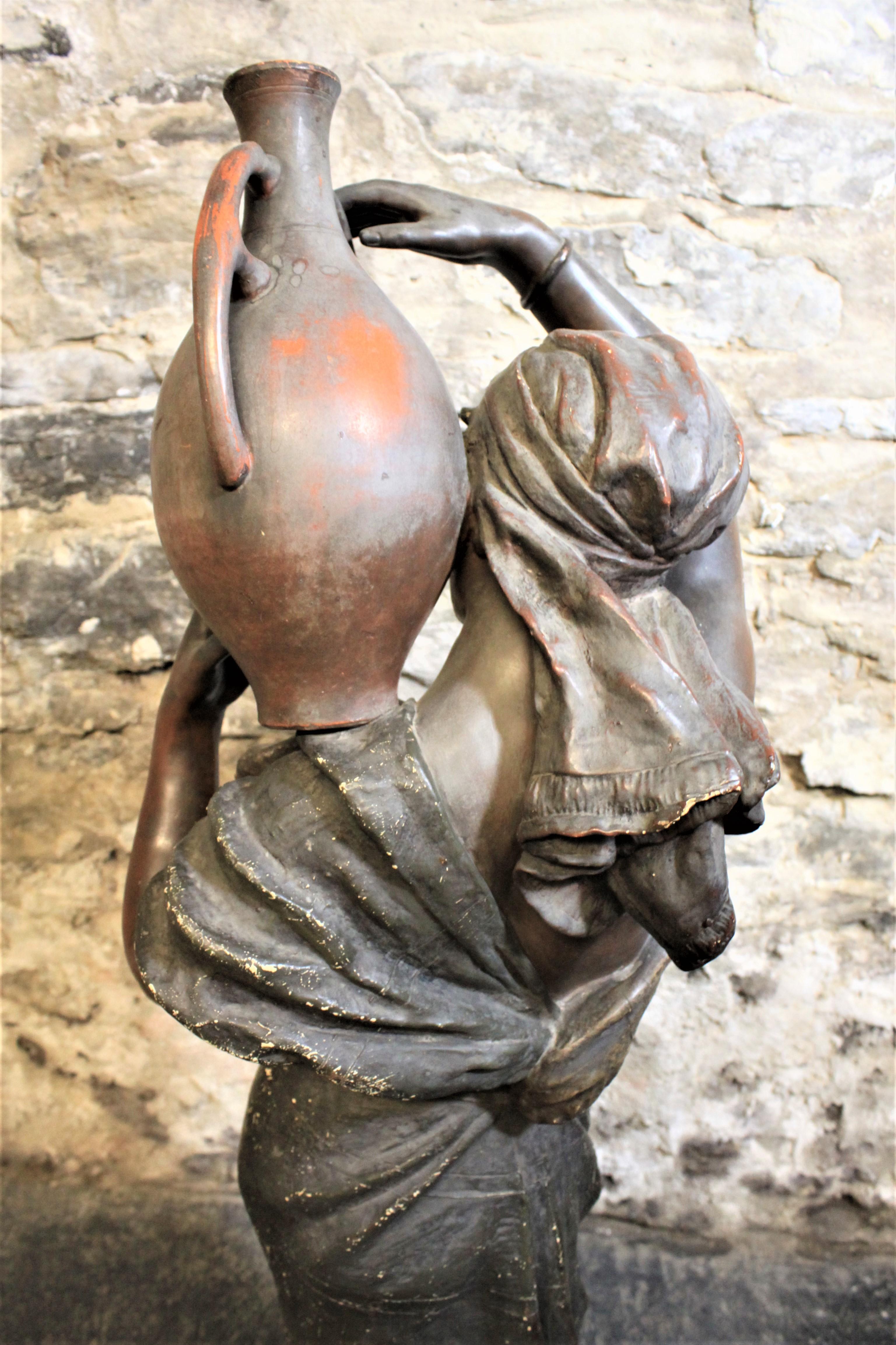 Hand-Crafted Large Goldscheider Patinated Terracotta Sculpture of a Woman Carrying Water For Sale